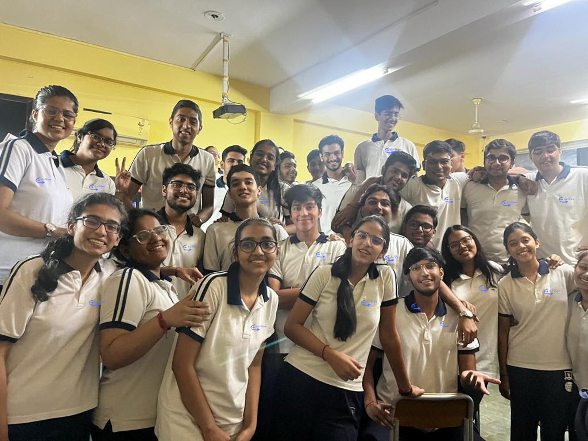 group of people wearing white and orange backpacks walking on gray concrete pavement during daytime