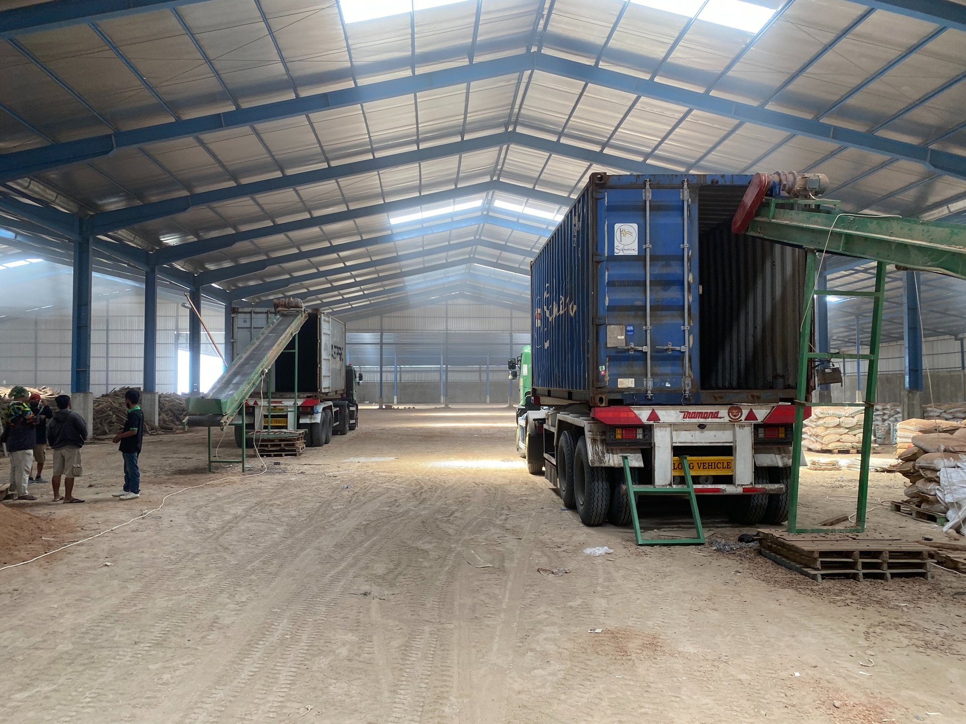 an abstract photo of a curved building with a blue sky in the background