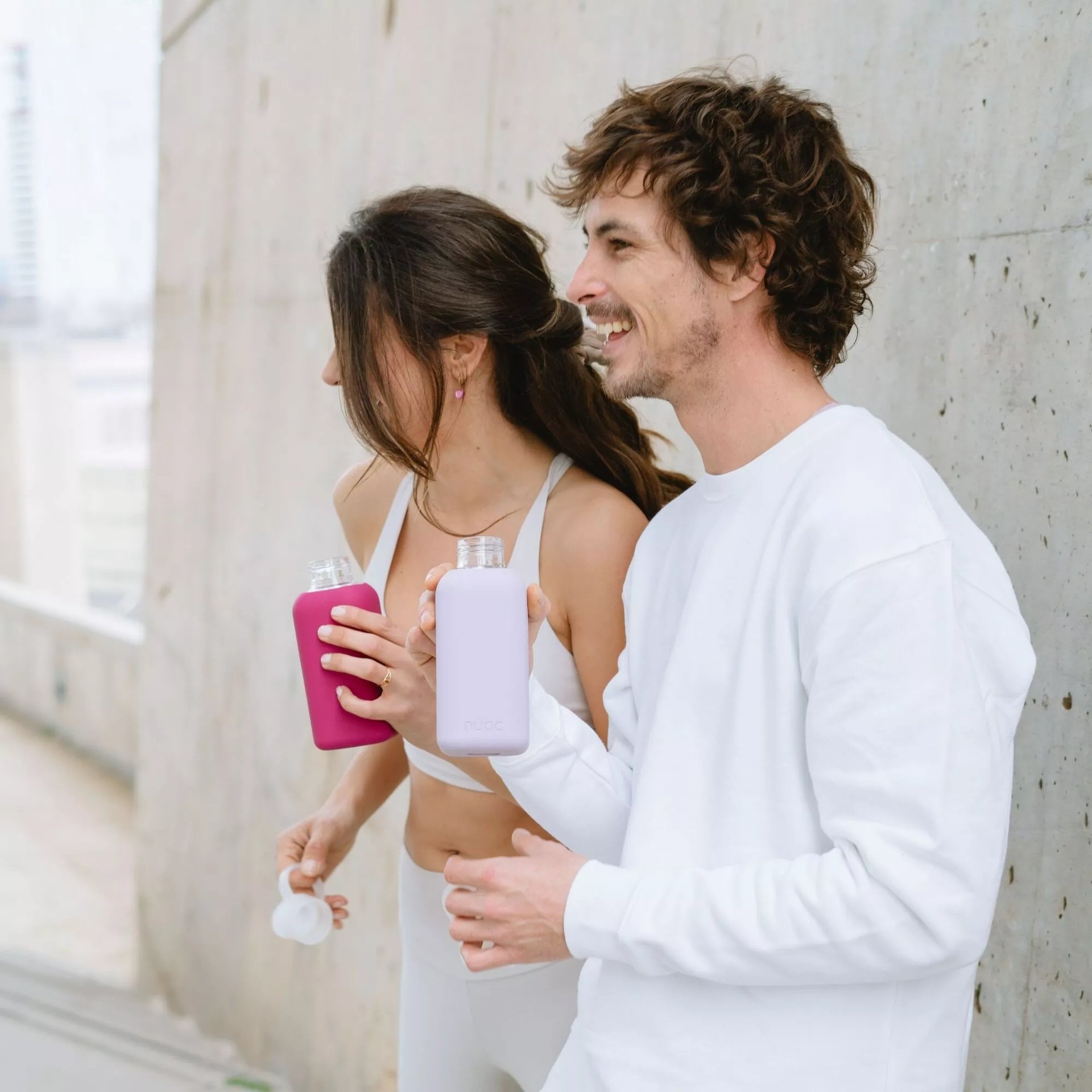 an abstract photo of a curved building with a blue sky in the background