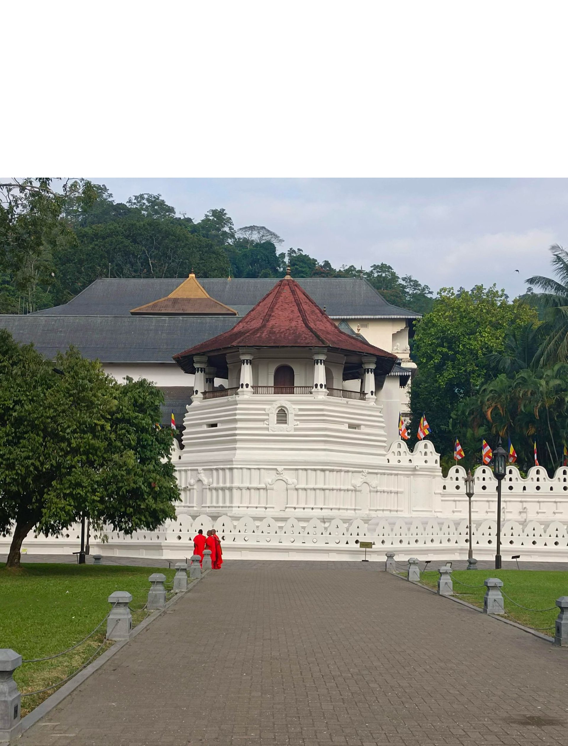 a large white building with a red roof