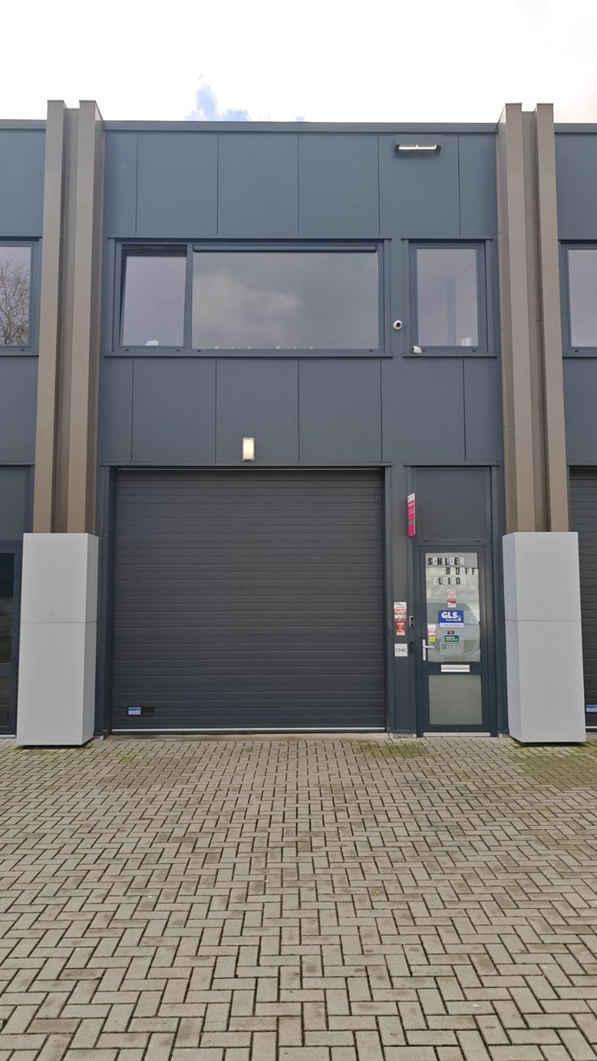 black and brown leather padded tub sofa