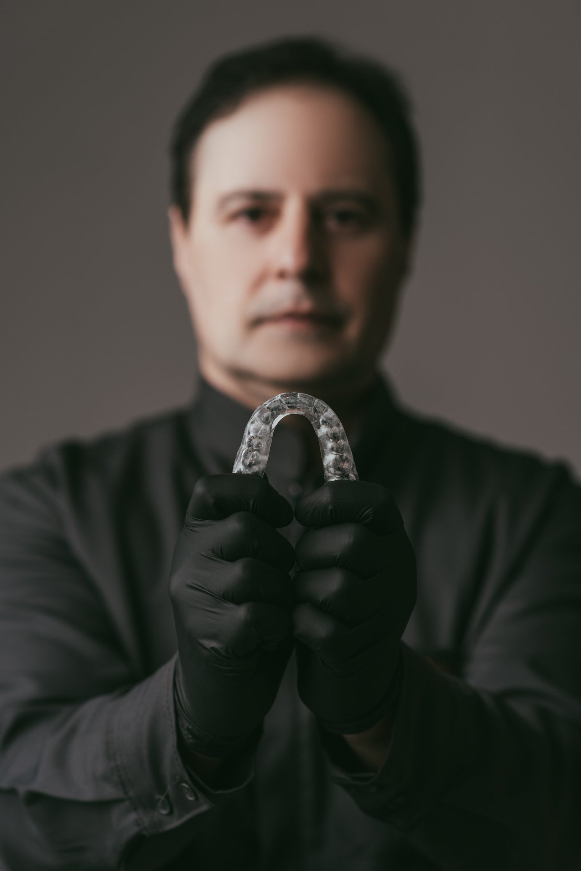 black and brown leather padded tub sofa