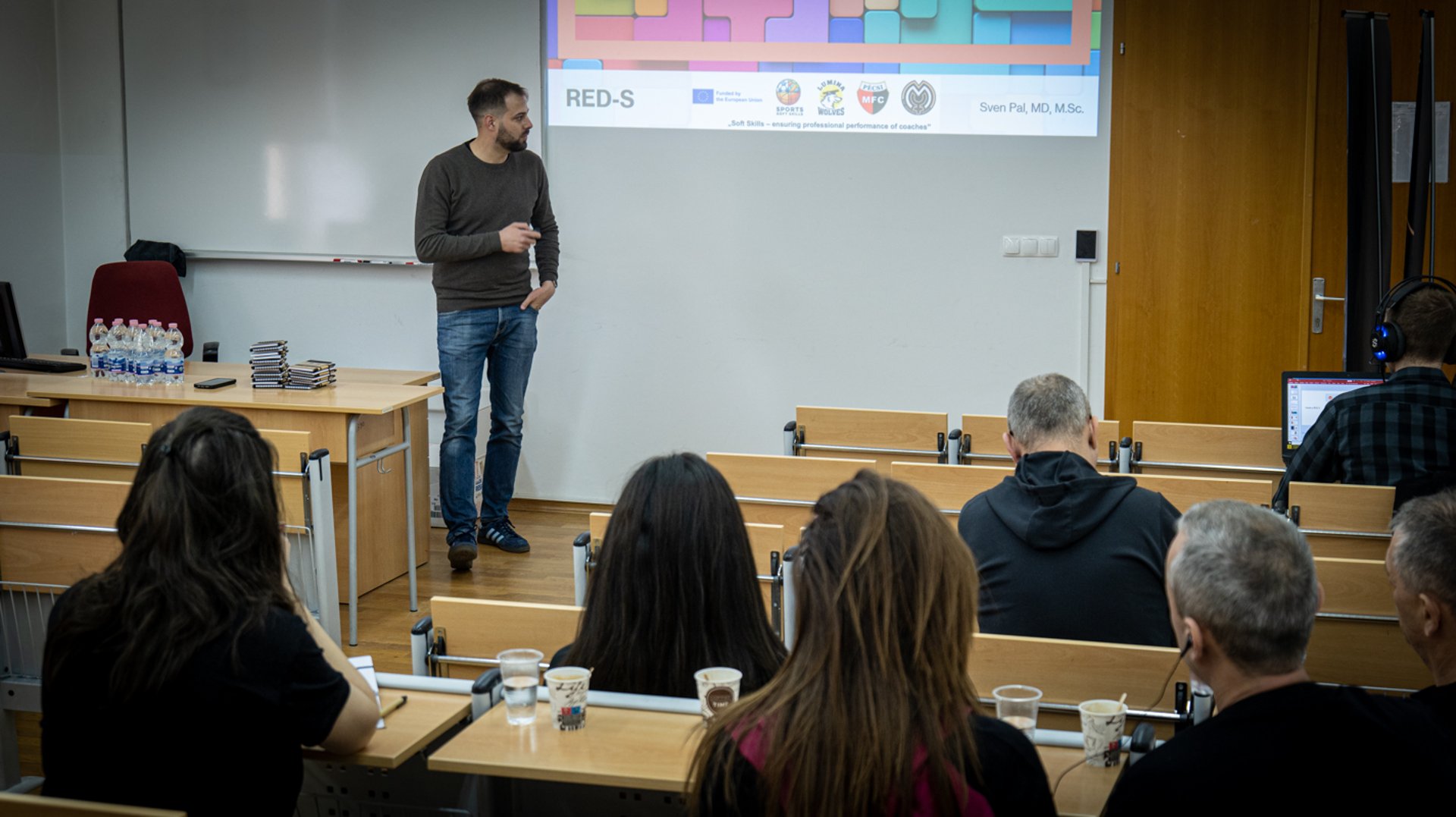 a soccer goalie's glove laying on a soccer field