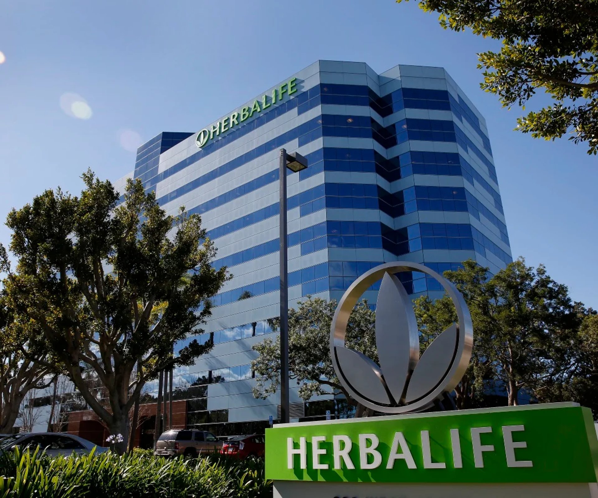 silhouette photo of man on cliff during sunset