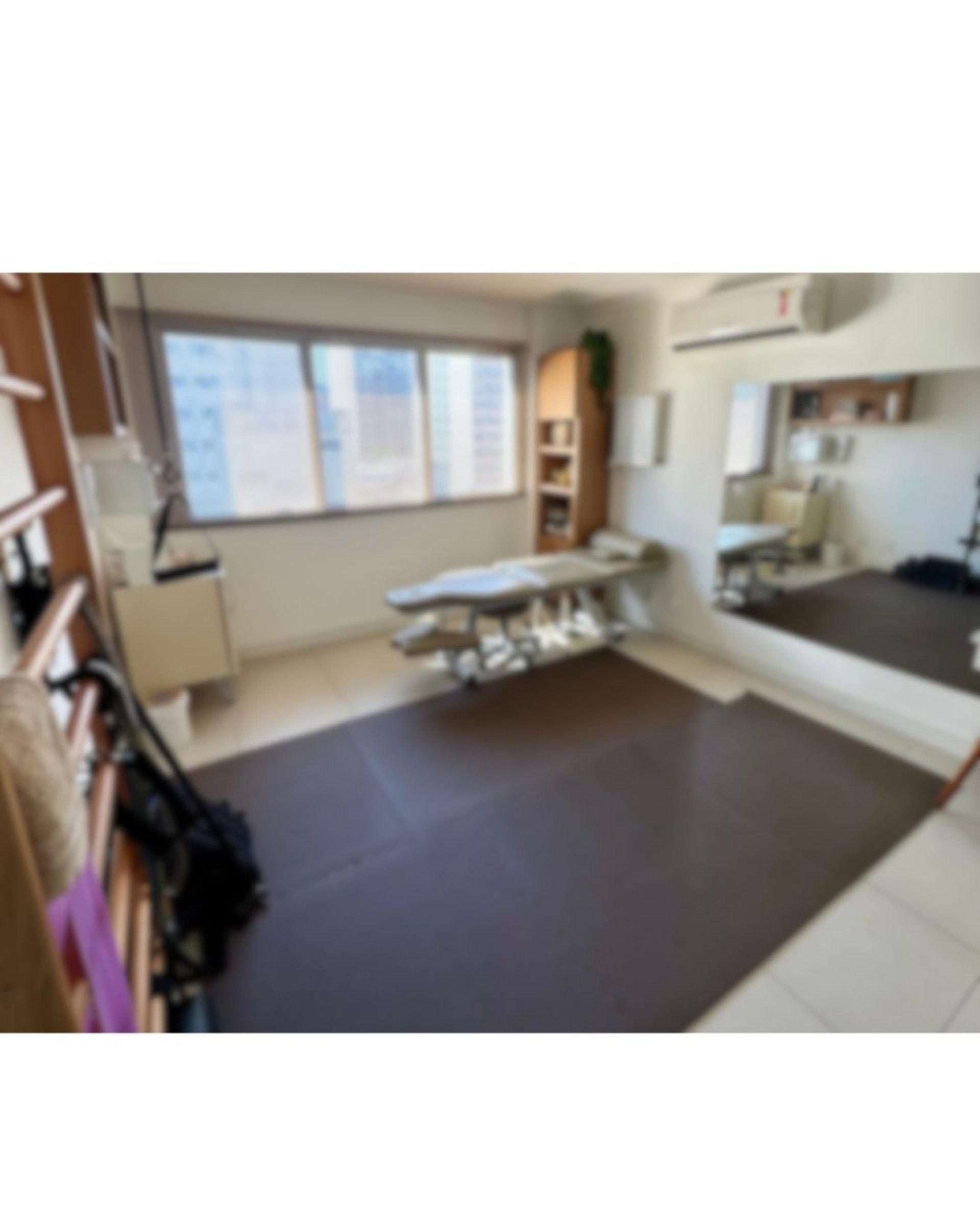 an abstract photo of a curved building with a blue sky in the background