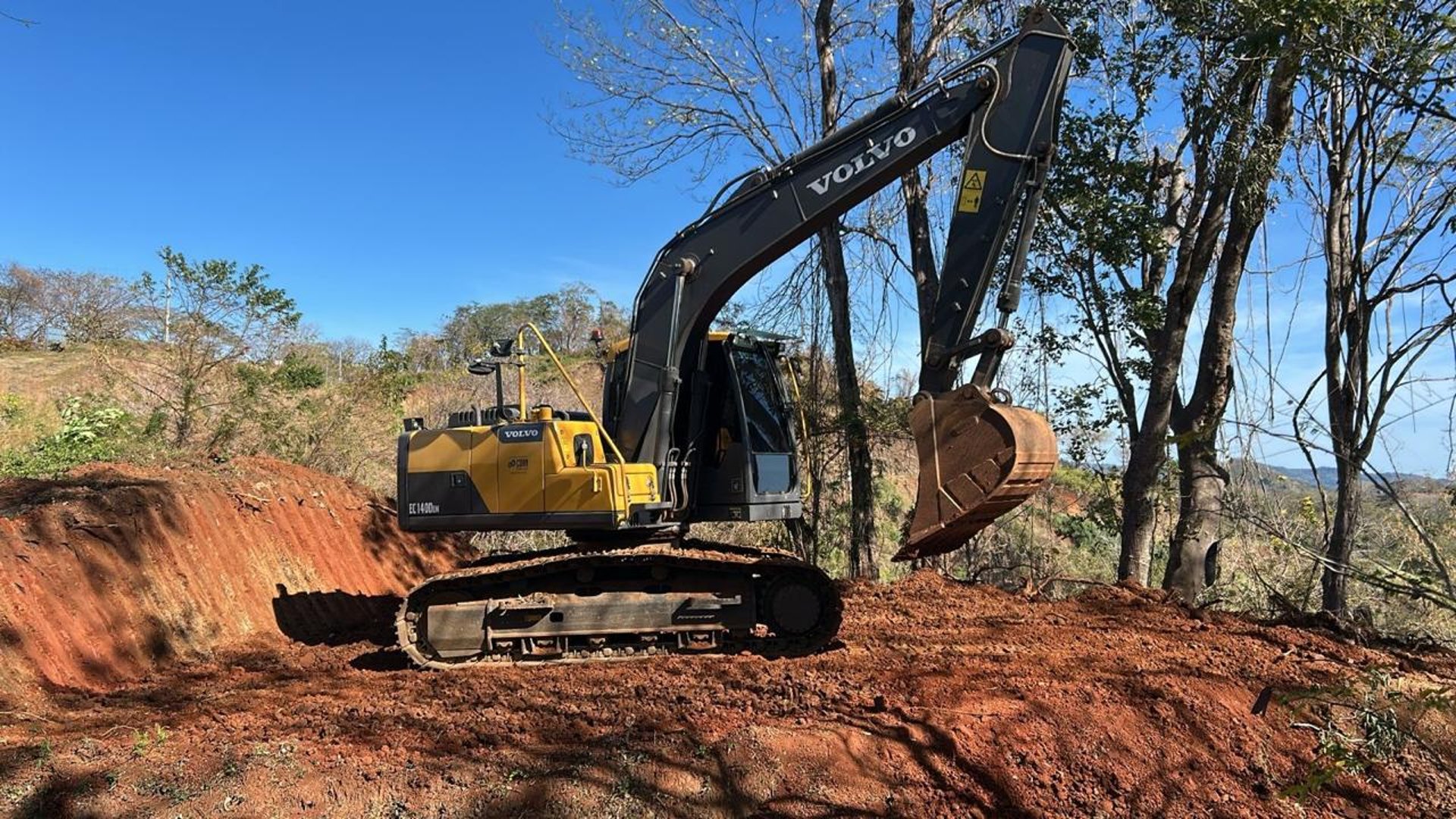 woman wearing yellow long-sleeved dress under white clouds and blue sky during daytime