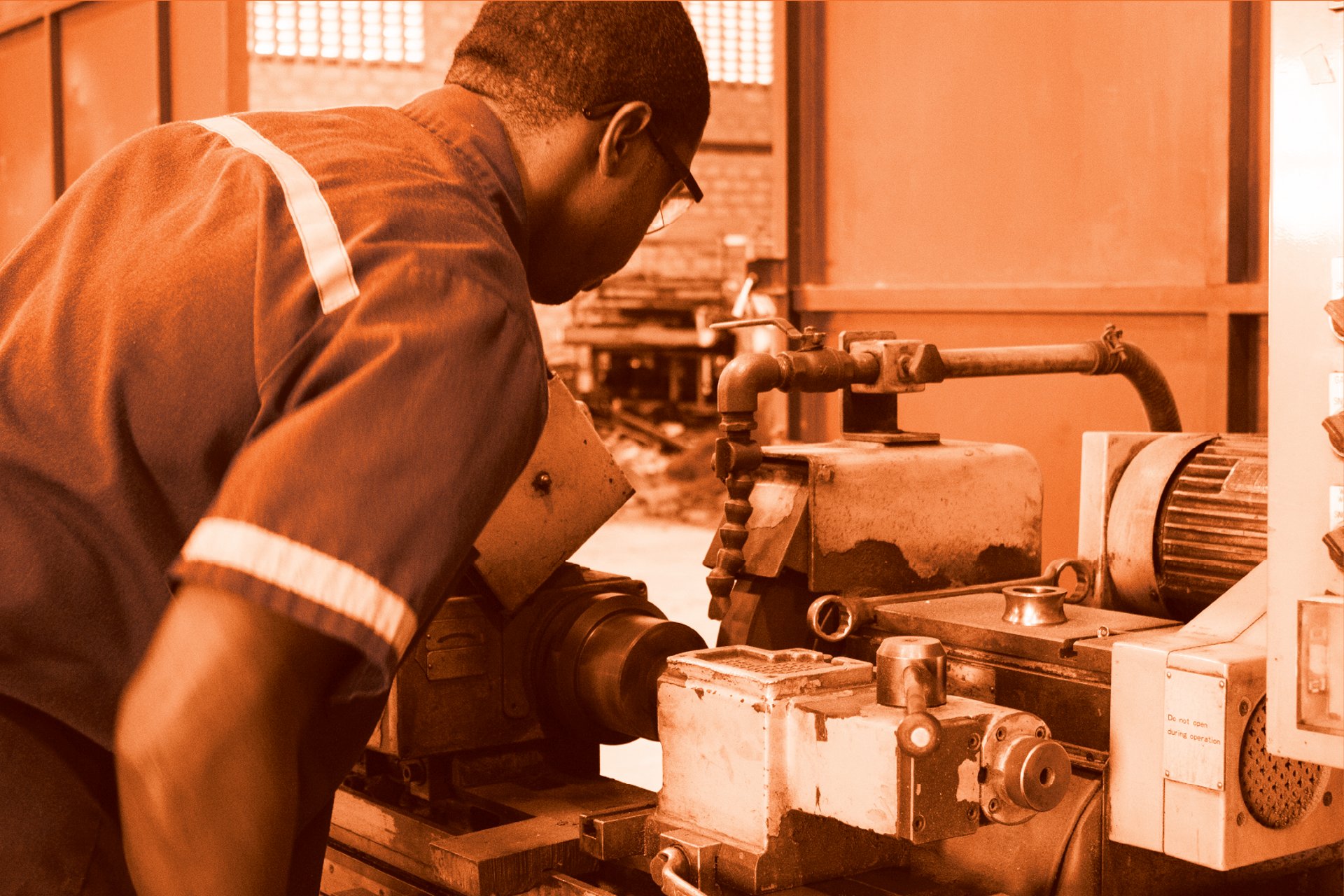 an abstract photo of a curved building with a blue sky in the background
