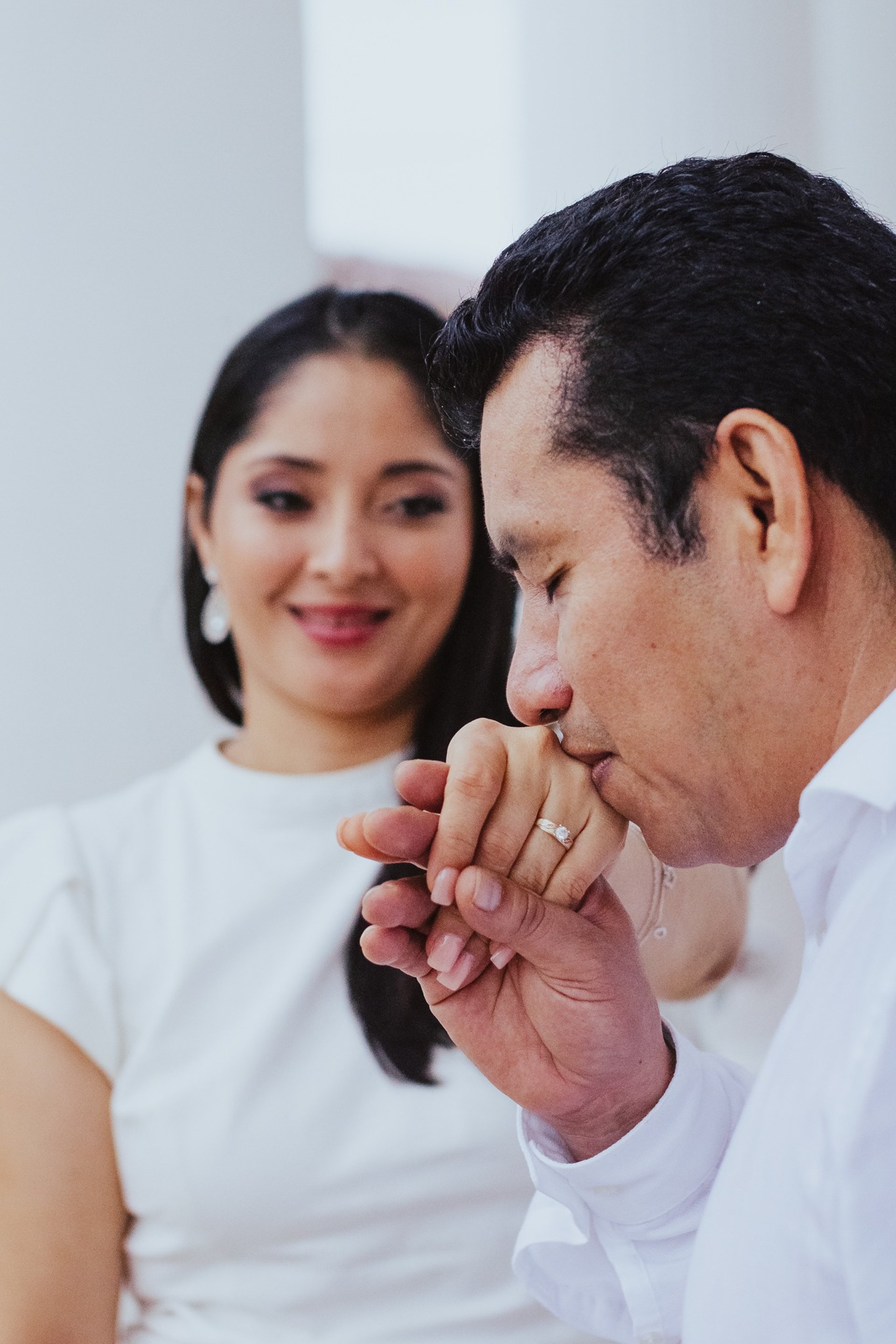 couple wearing silver-colored rings