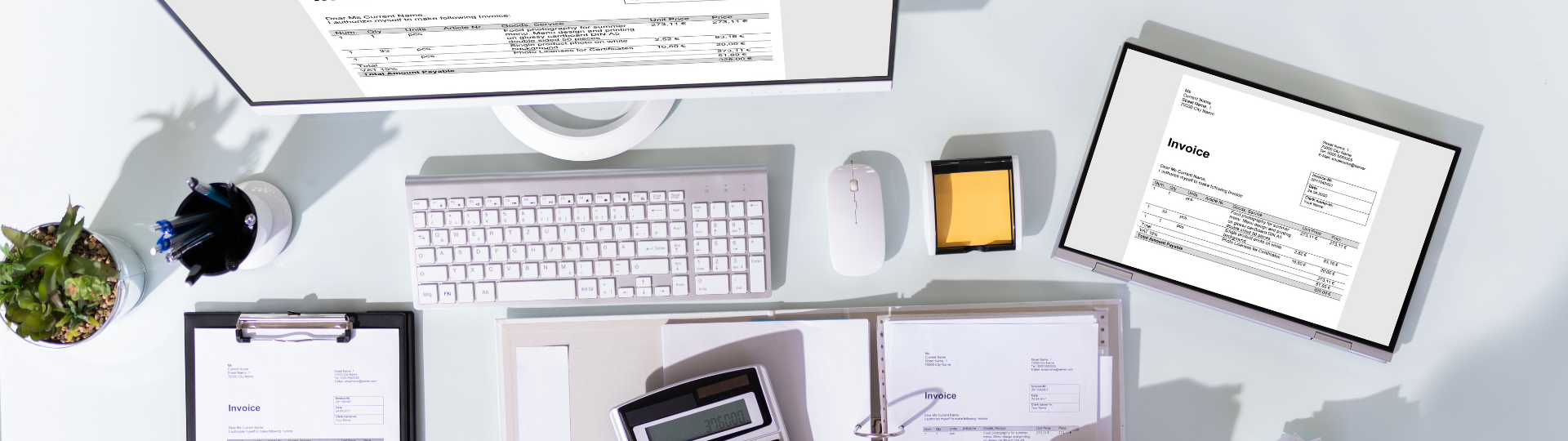 a calculator sitting on top of a table next to a laptop