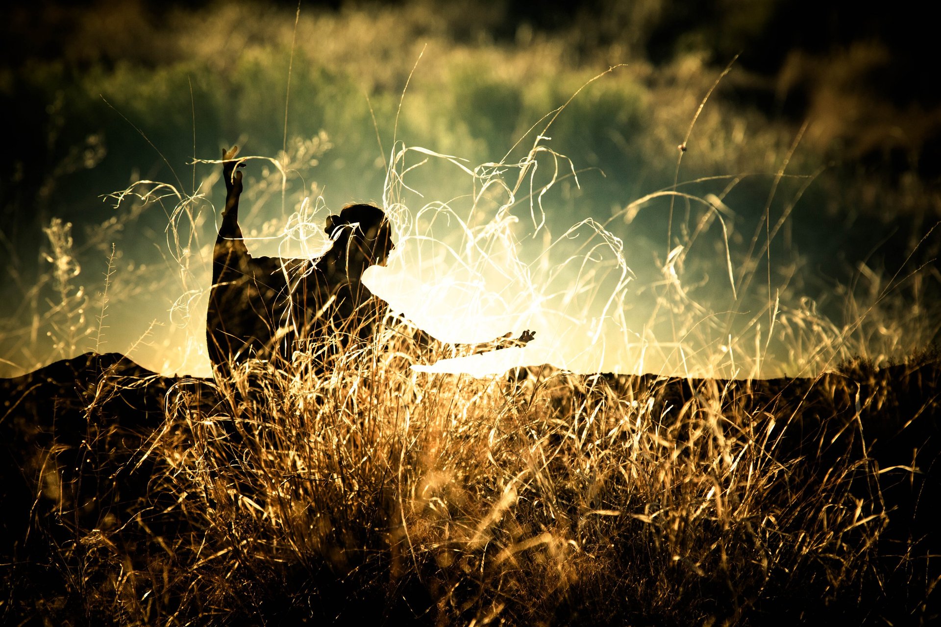 woman wearing yellow long-sleeved dress under white clouds and blue sky during daytime