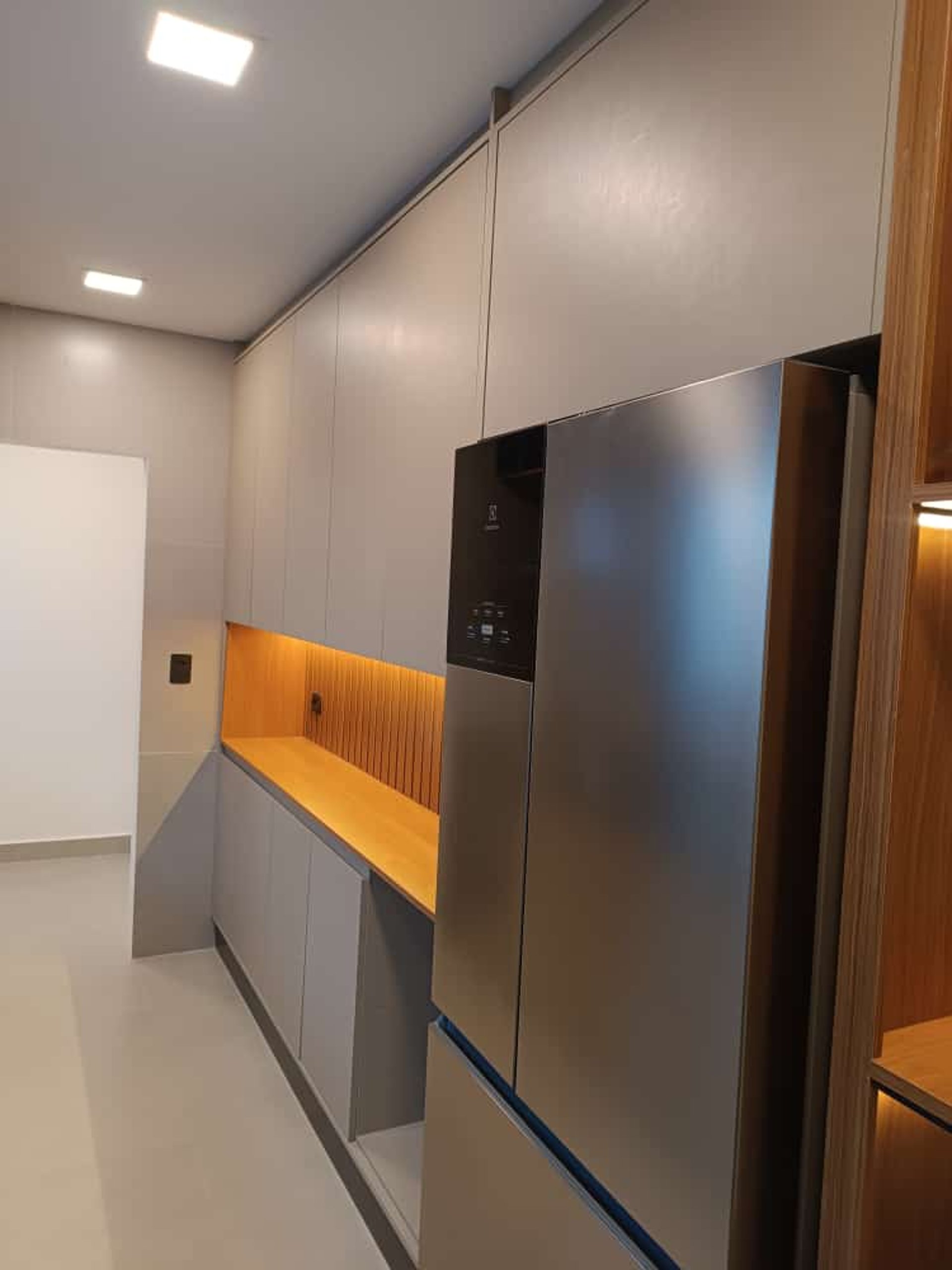 woman wearing yellow long-sleeved dress under white clouds and blue sky during daytime