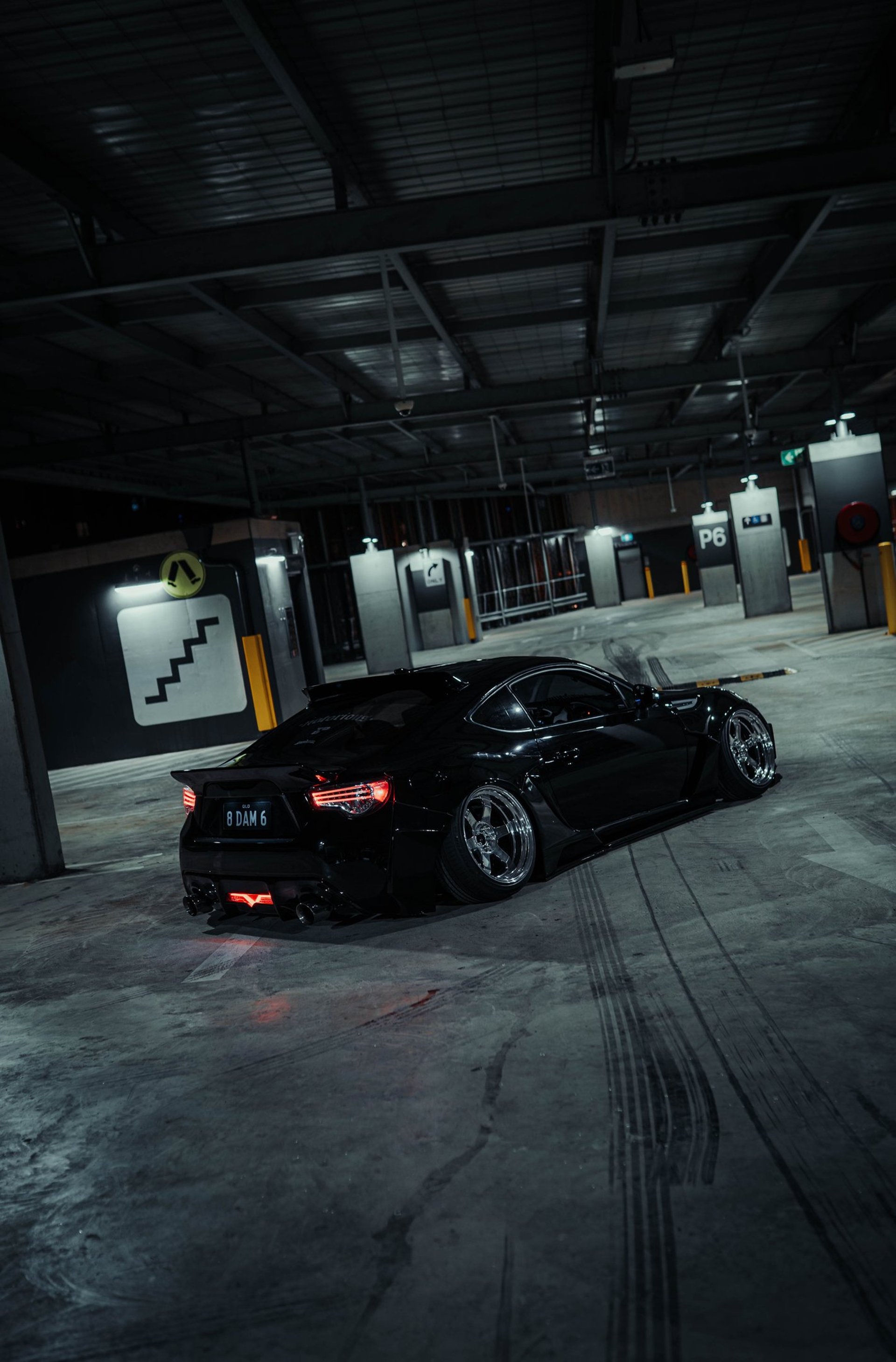 an abstract photo of a curved building with a blue sky in the background