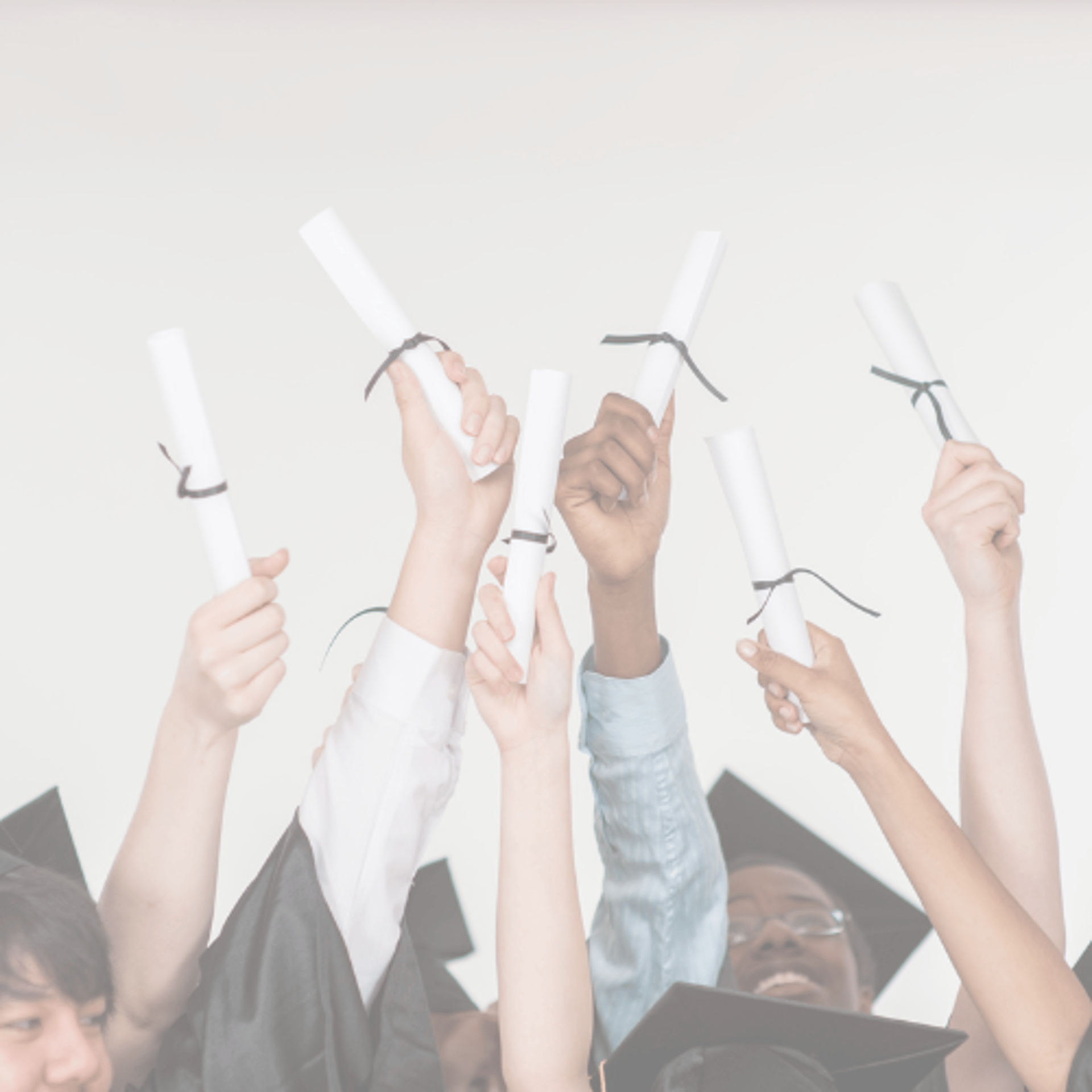 a group of people holding graduation caps