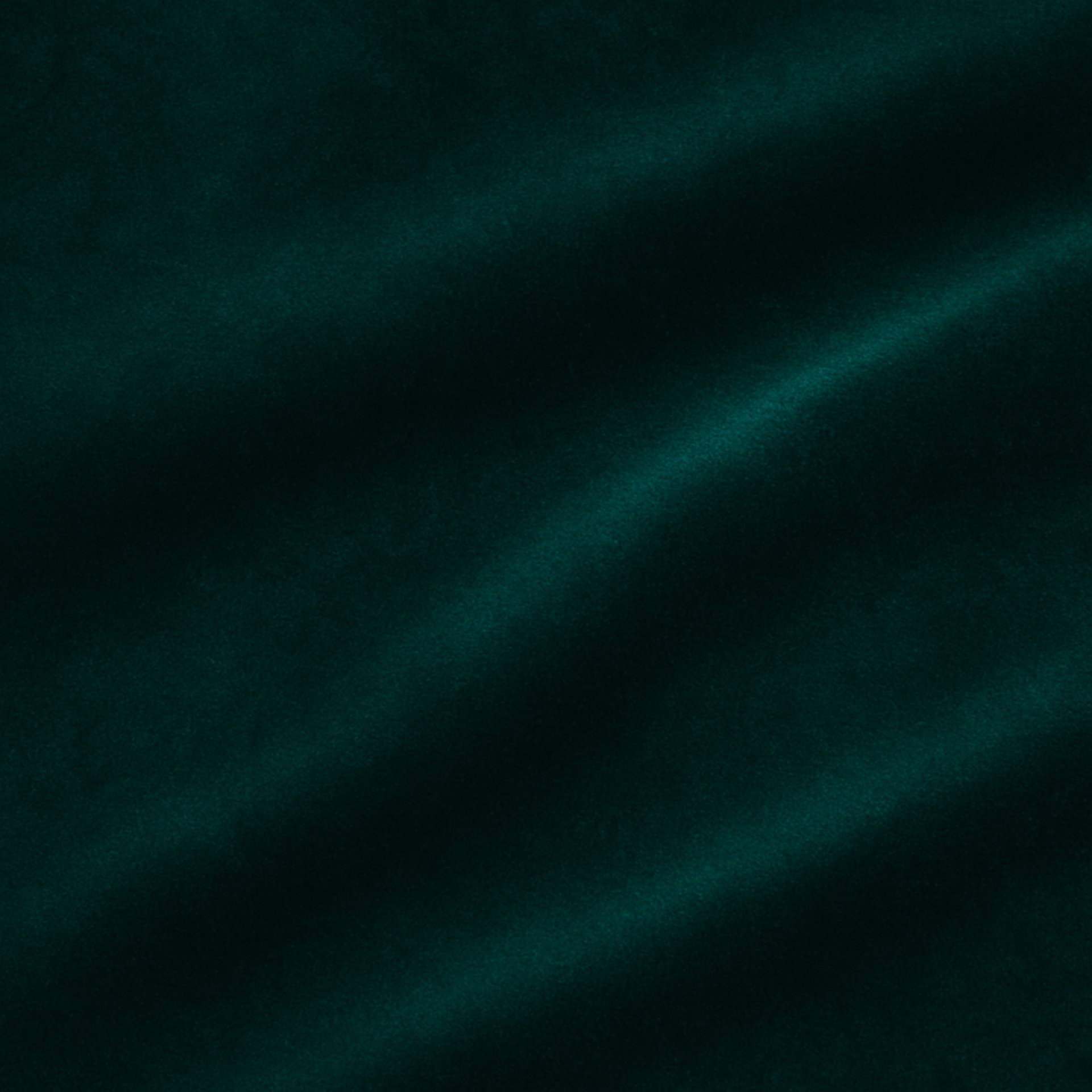 green textile in close up photography