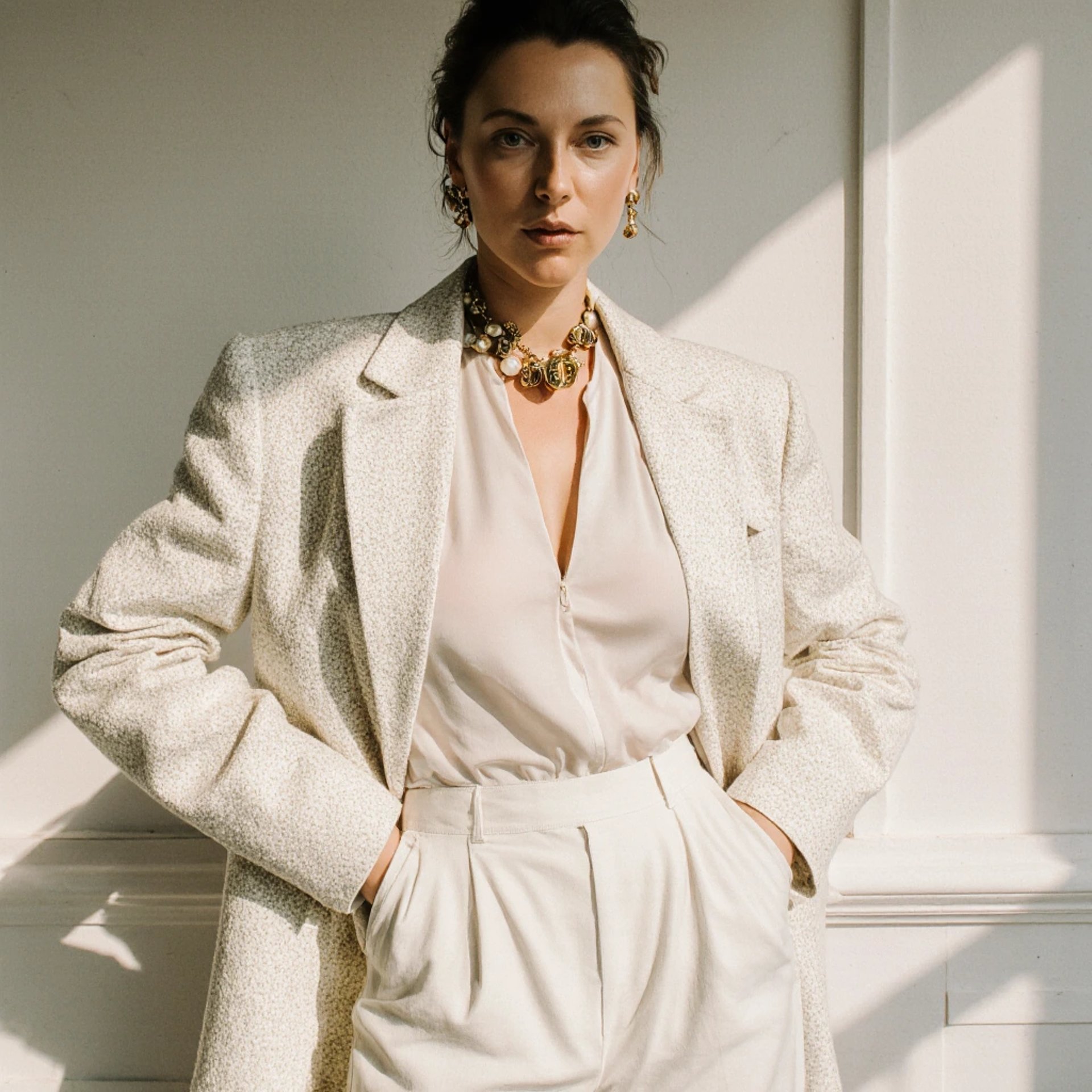 woman in black tank top writing on white paper