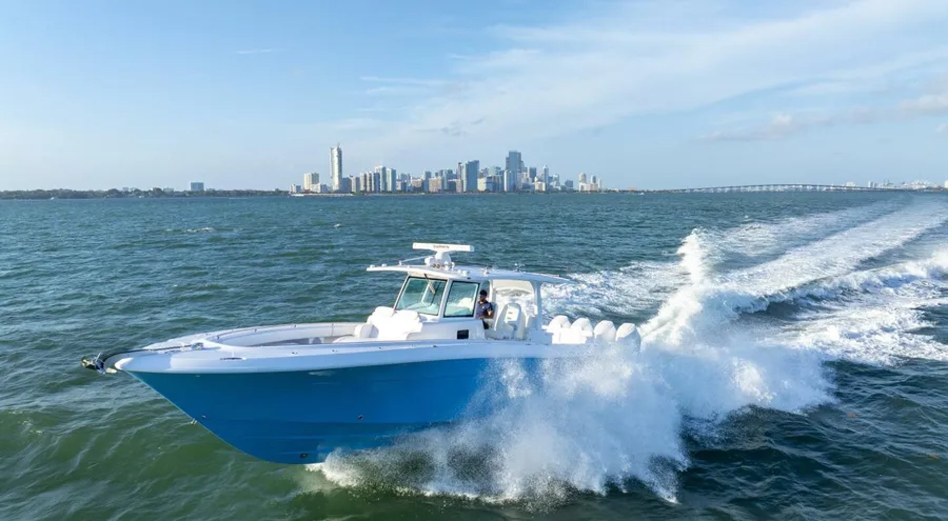 an abstract photo of a curved building with a blue sky in the background