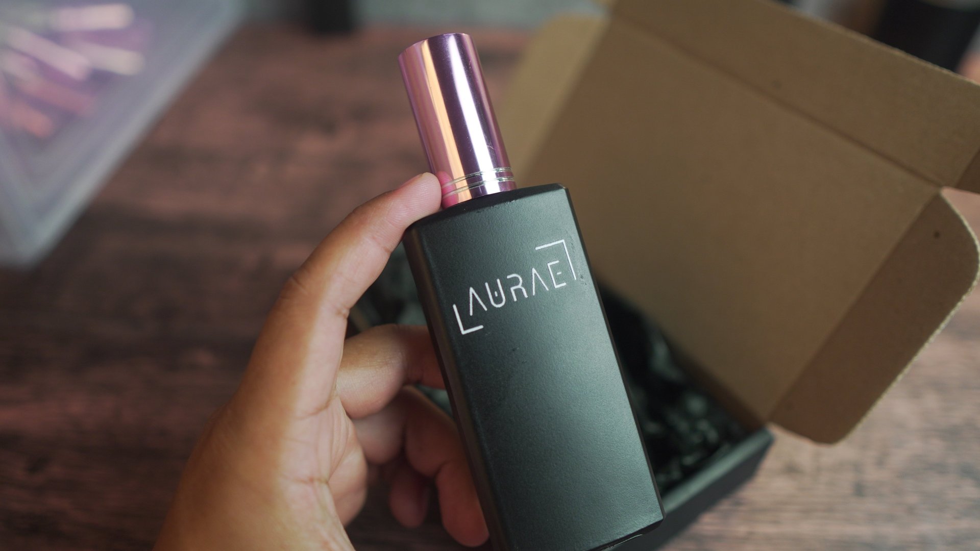 A bottle of perfume sitting on top of a table