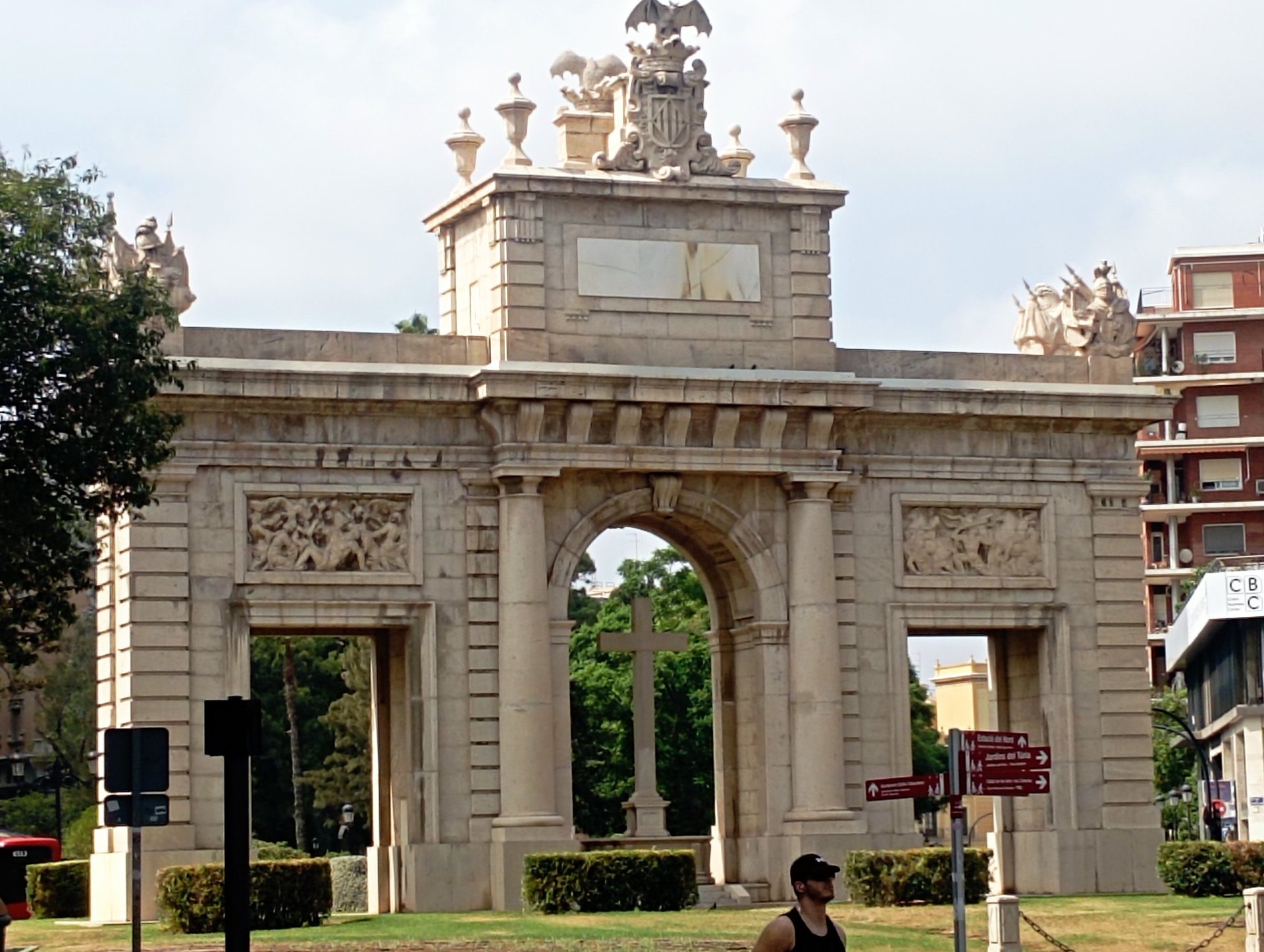 empty hallway between concrete buildings during daytime