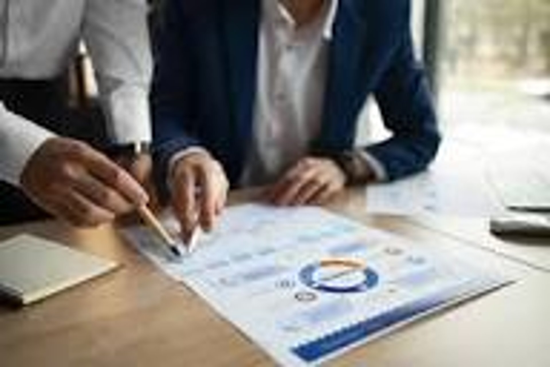 man in white dress shirt sitting beside woman in black long sleeve shirt