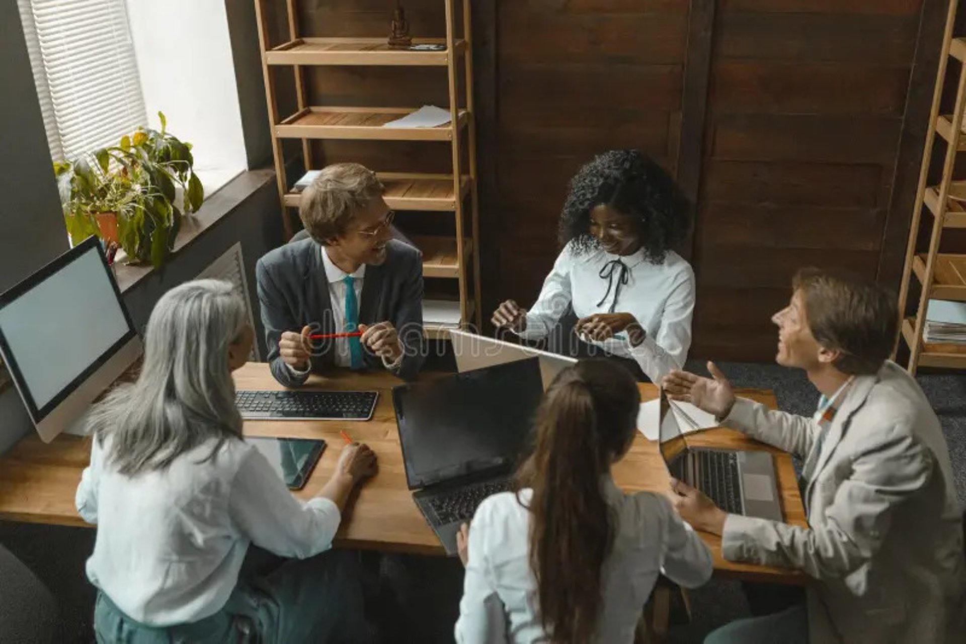 woman placing sticky notes on wall