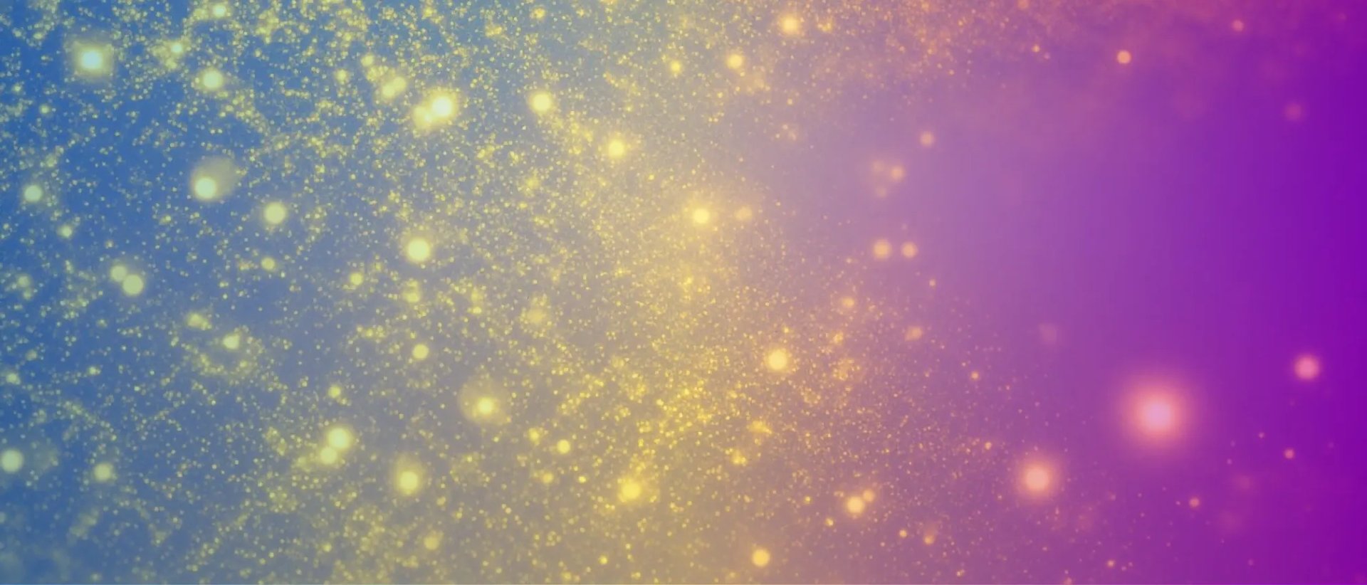Colorful gradient background with glowing particles blending blue, purple, and yellow light
