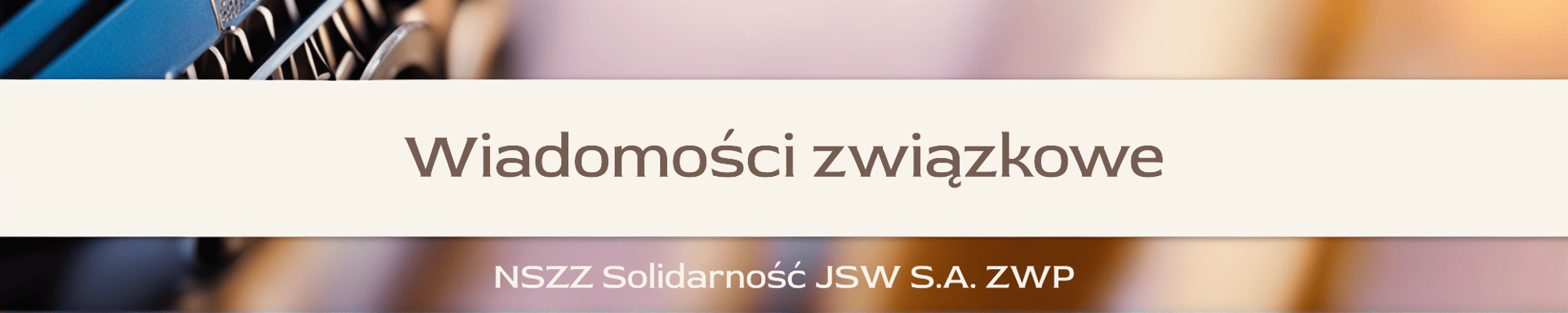 gray and black typewriter on brown wooden table