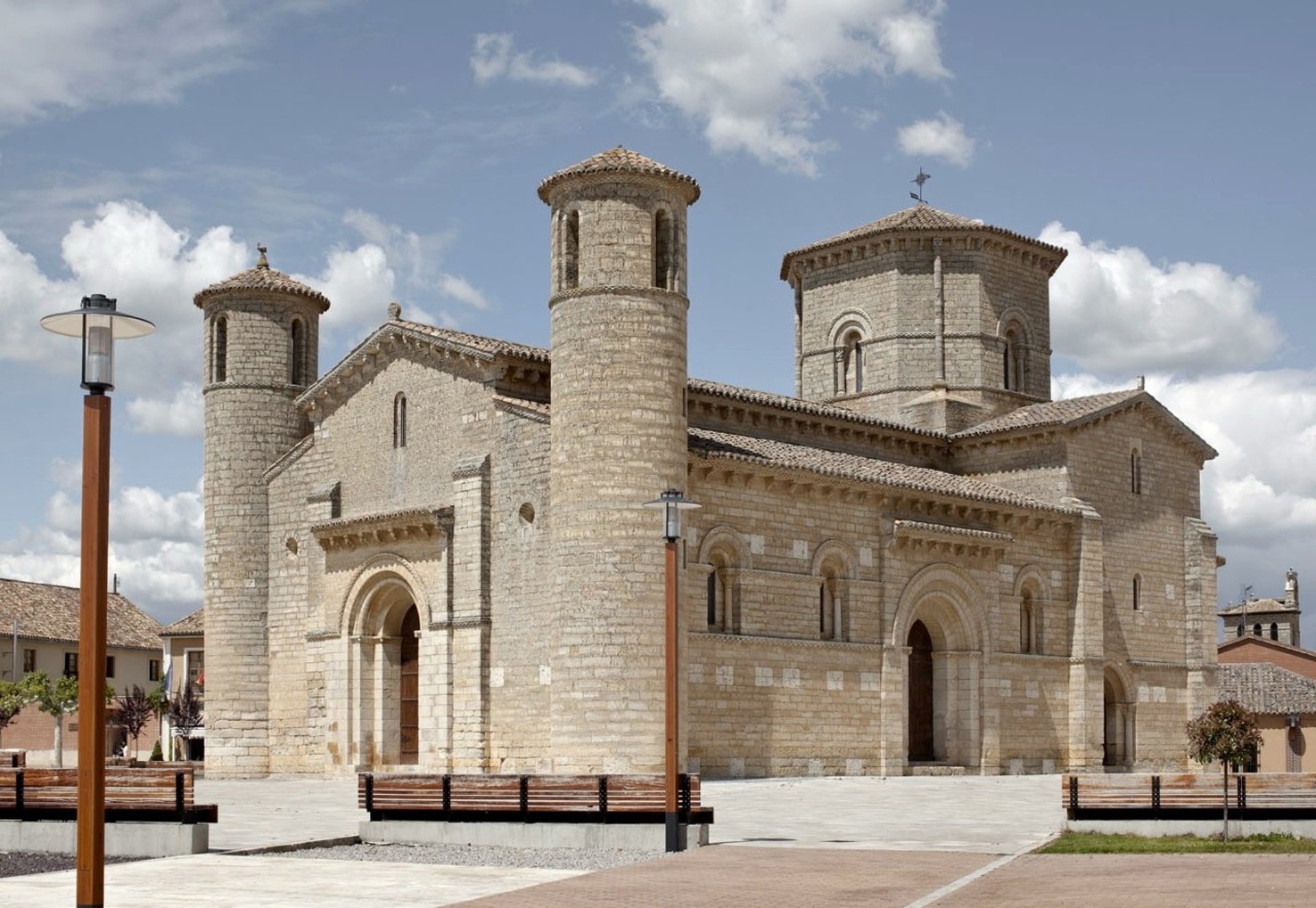 woman wearing yellow long-sleeved dress under white clouds and blue sky during daytime