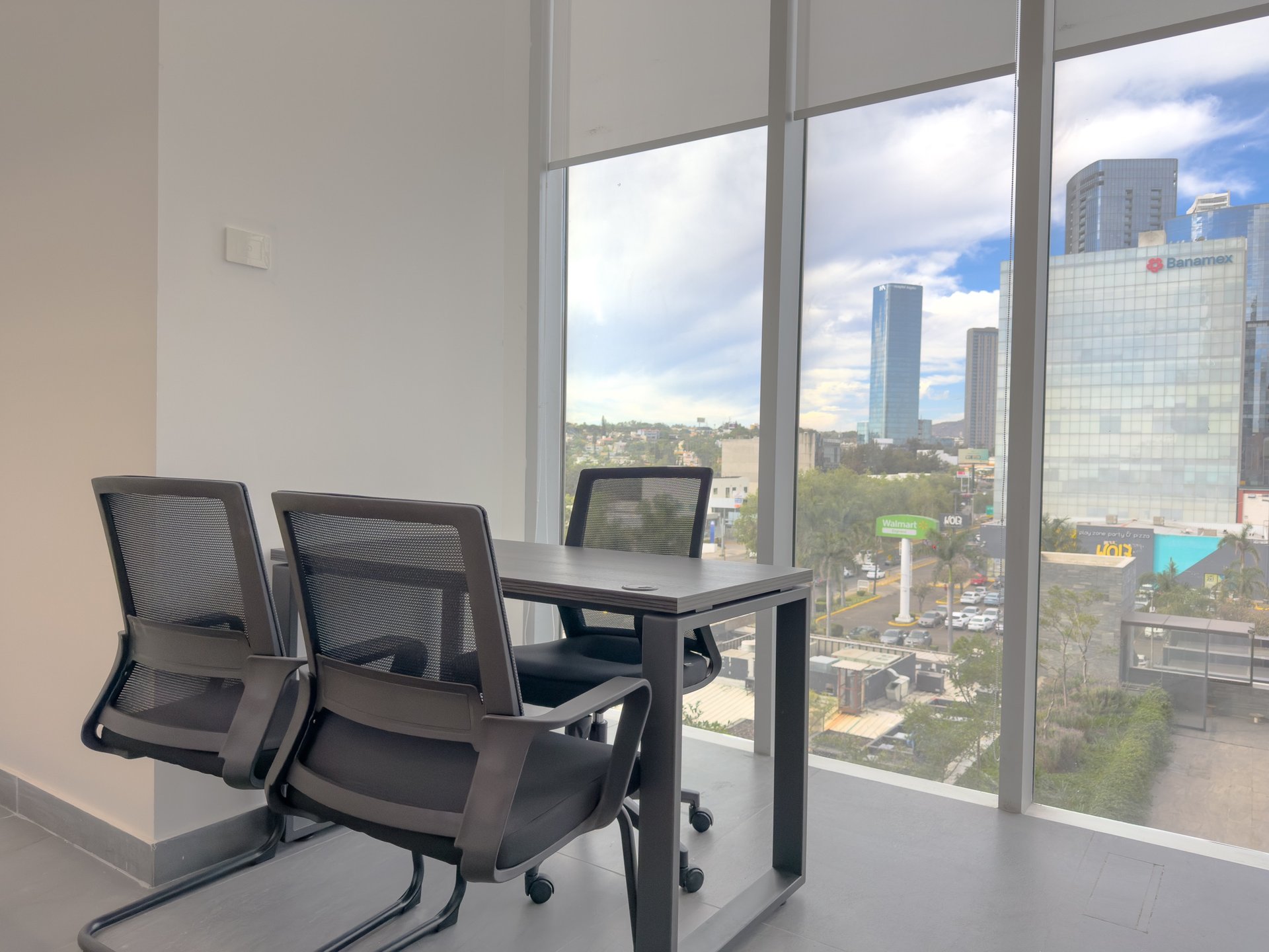 an abstract photo of a curved building with a blue sky in the background