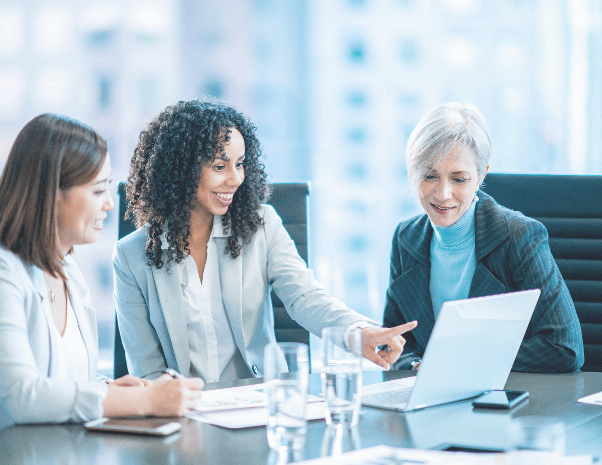 woman in black jacket sitting beside woman in white blazer