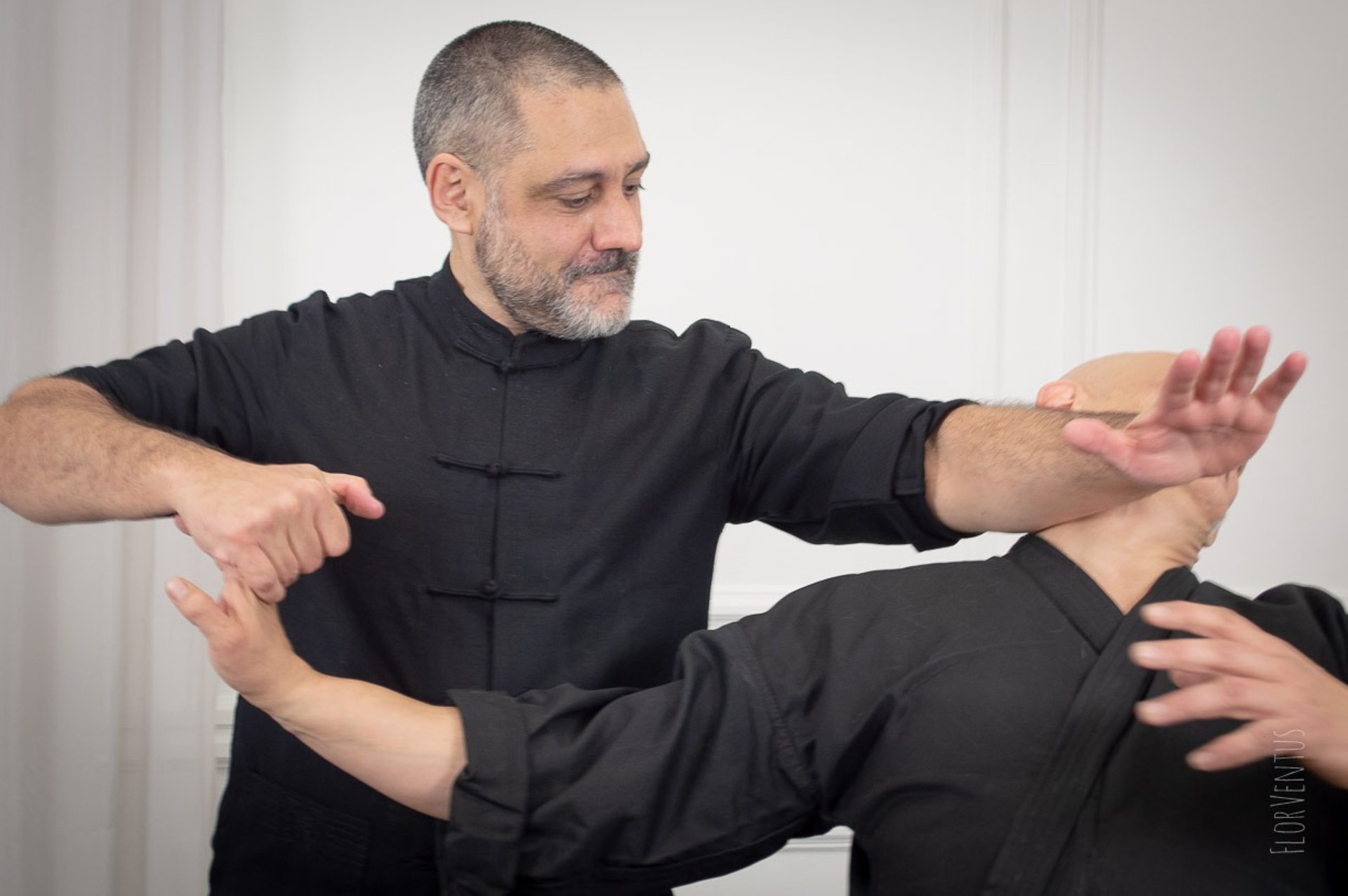 an abstract photo of a curved building with a blue sky in the background