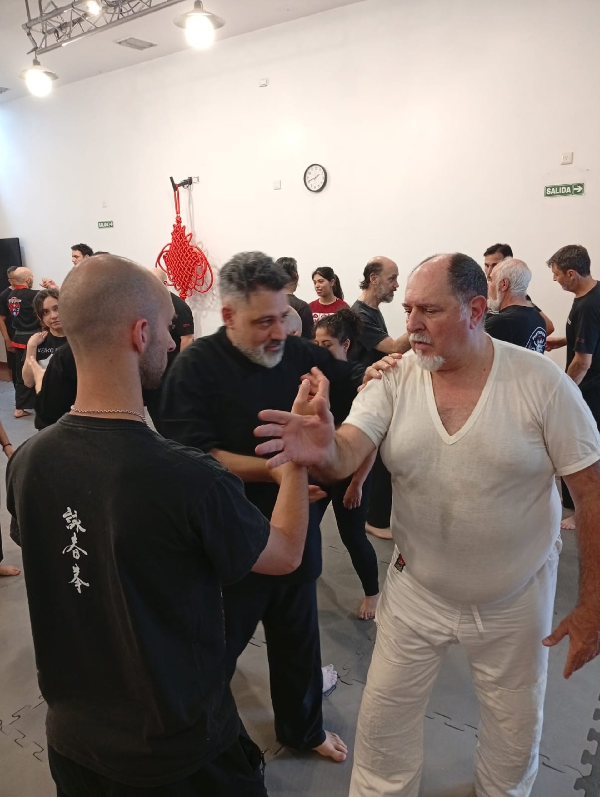 an abstract photo of a curved building with a blue sky in the background