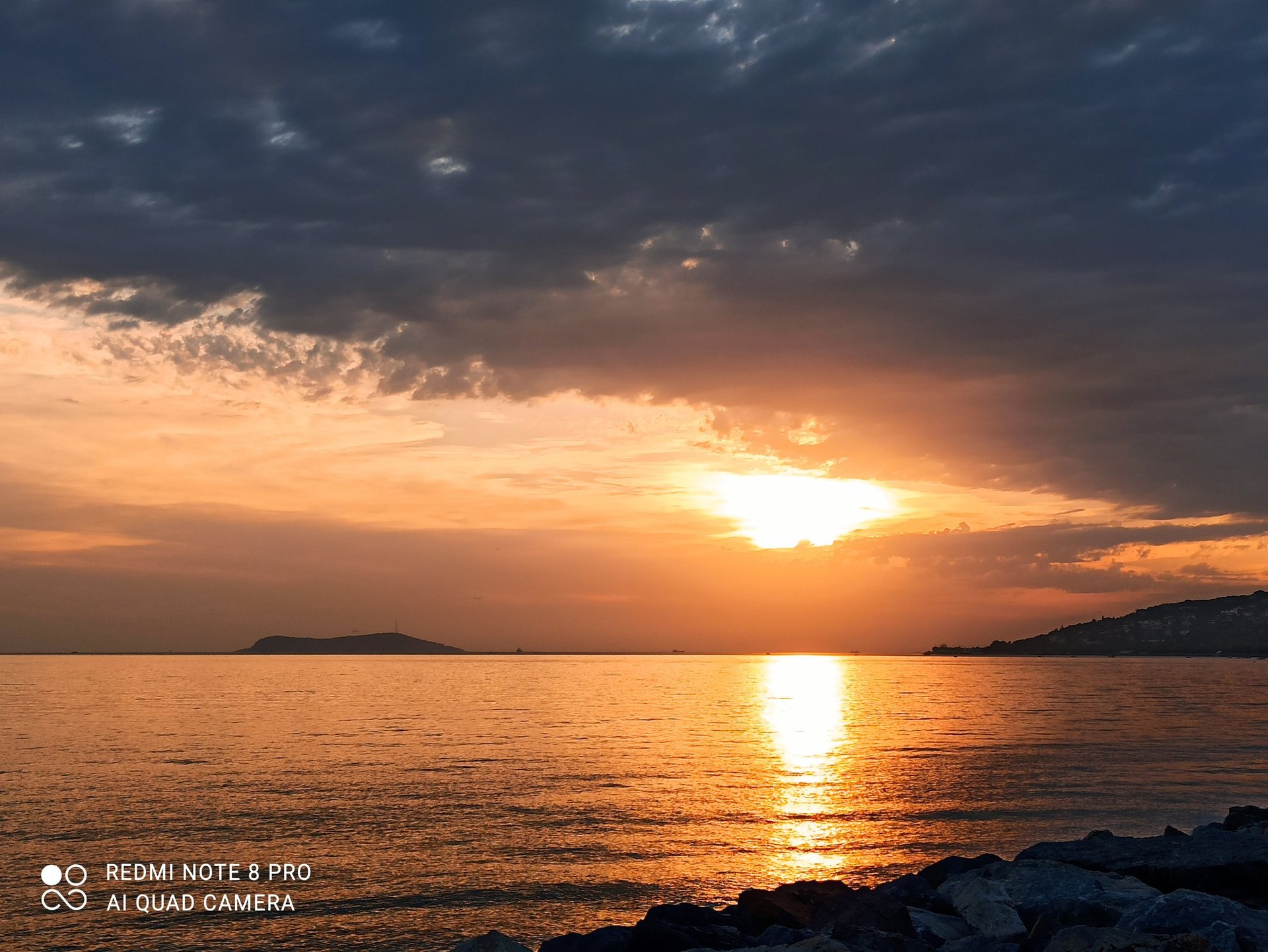 an abstract photo of a curved building with a blue sky in the background