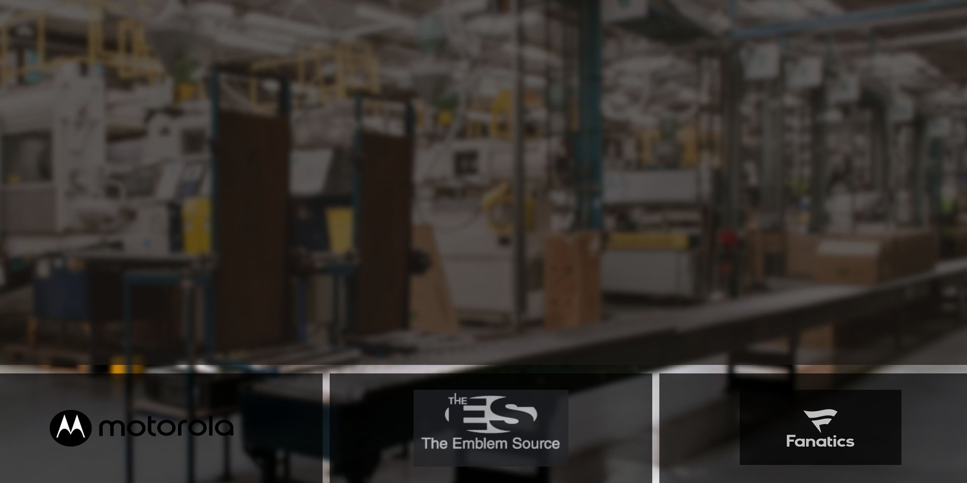 Man standing in a cluttered industrial workshop