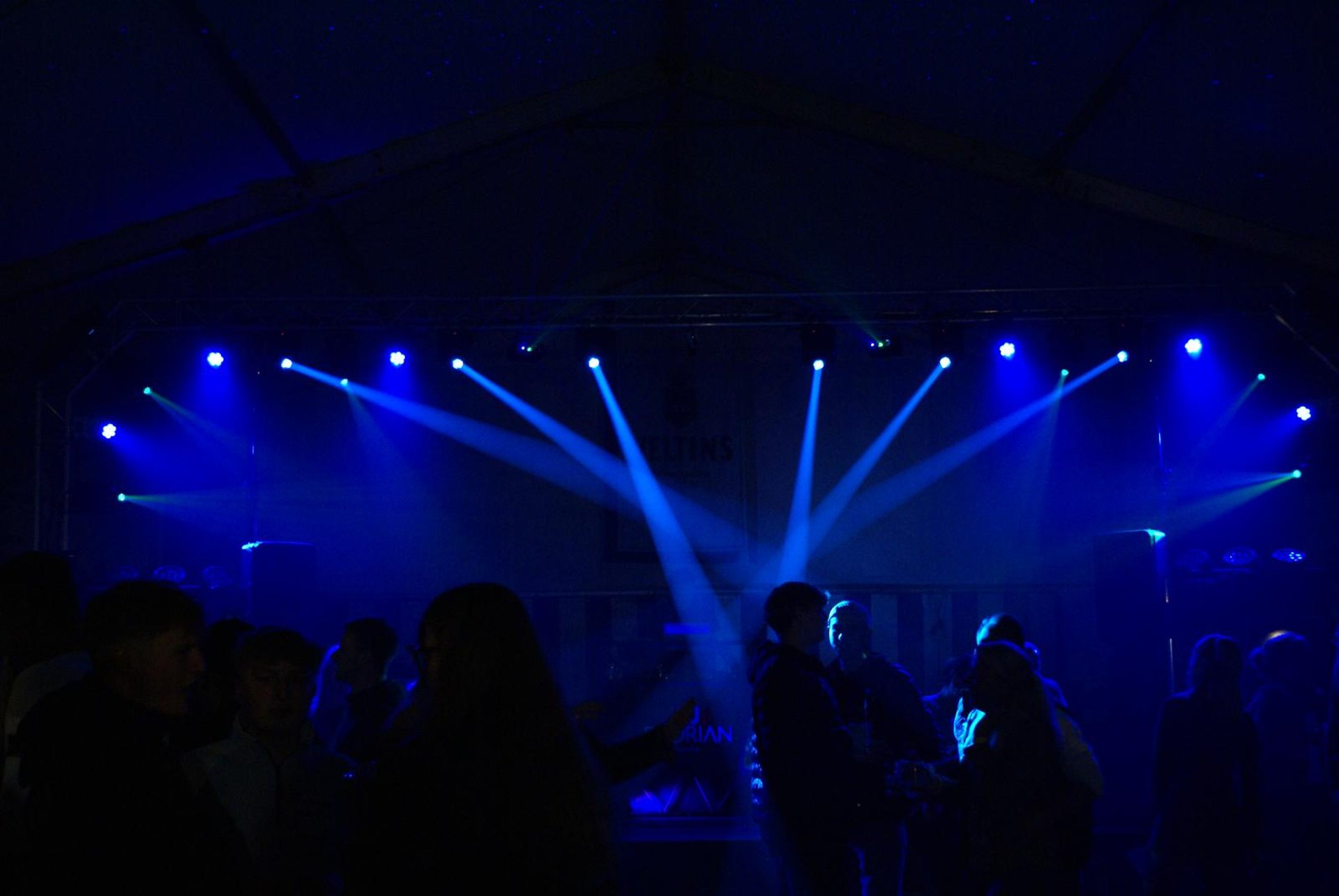 an abstract photo of a curved building with a blue sky in the background