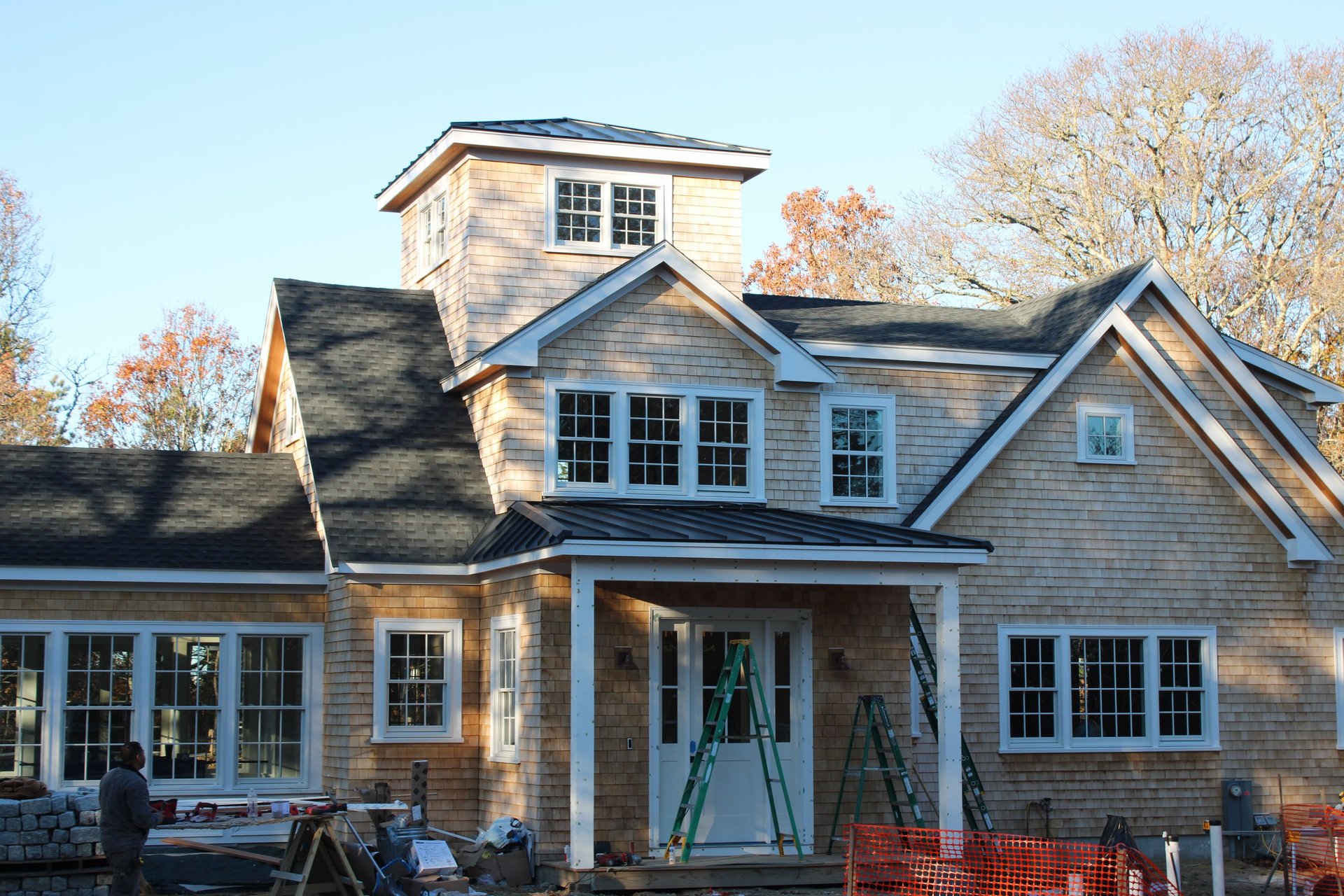 an abstract photo of a curved building with a blue sky in the background