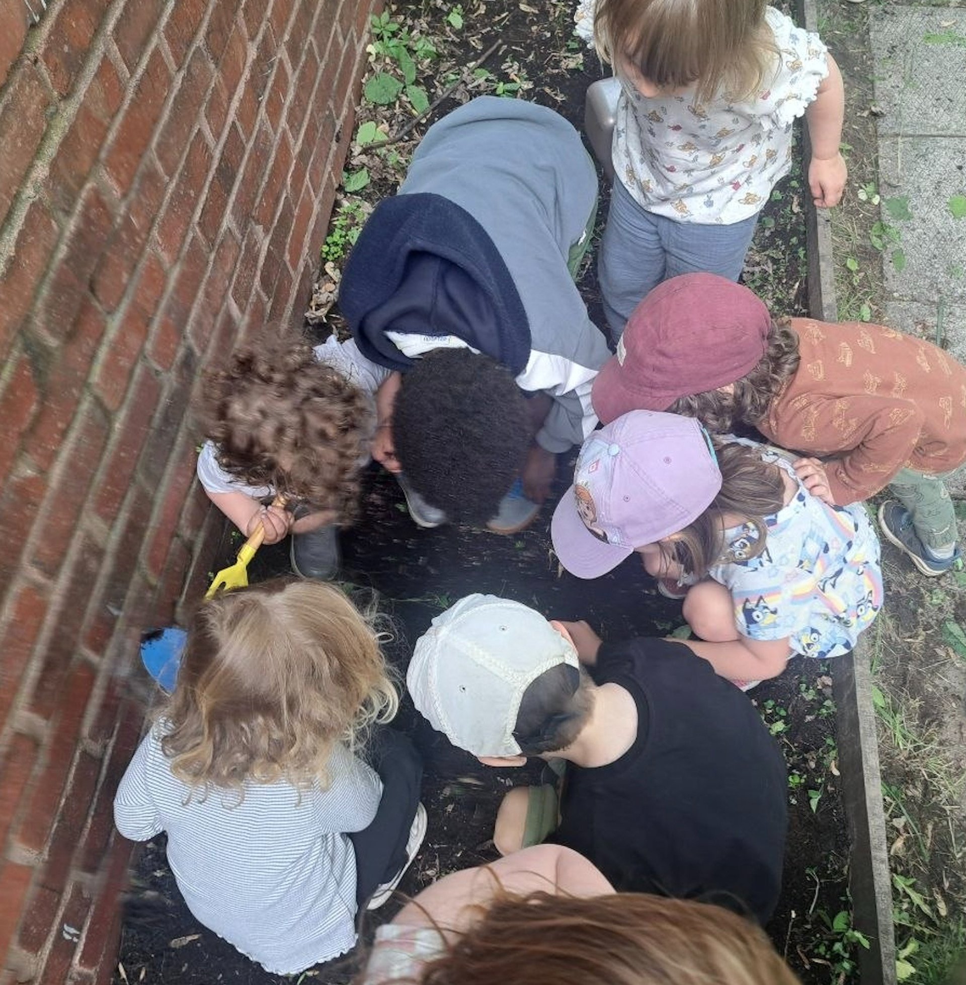 boy in white long sleeve shirt writing on white paper