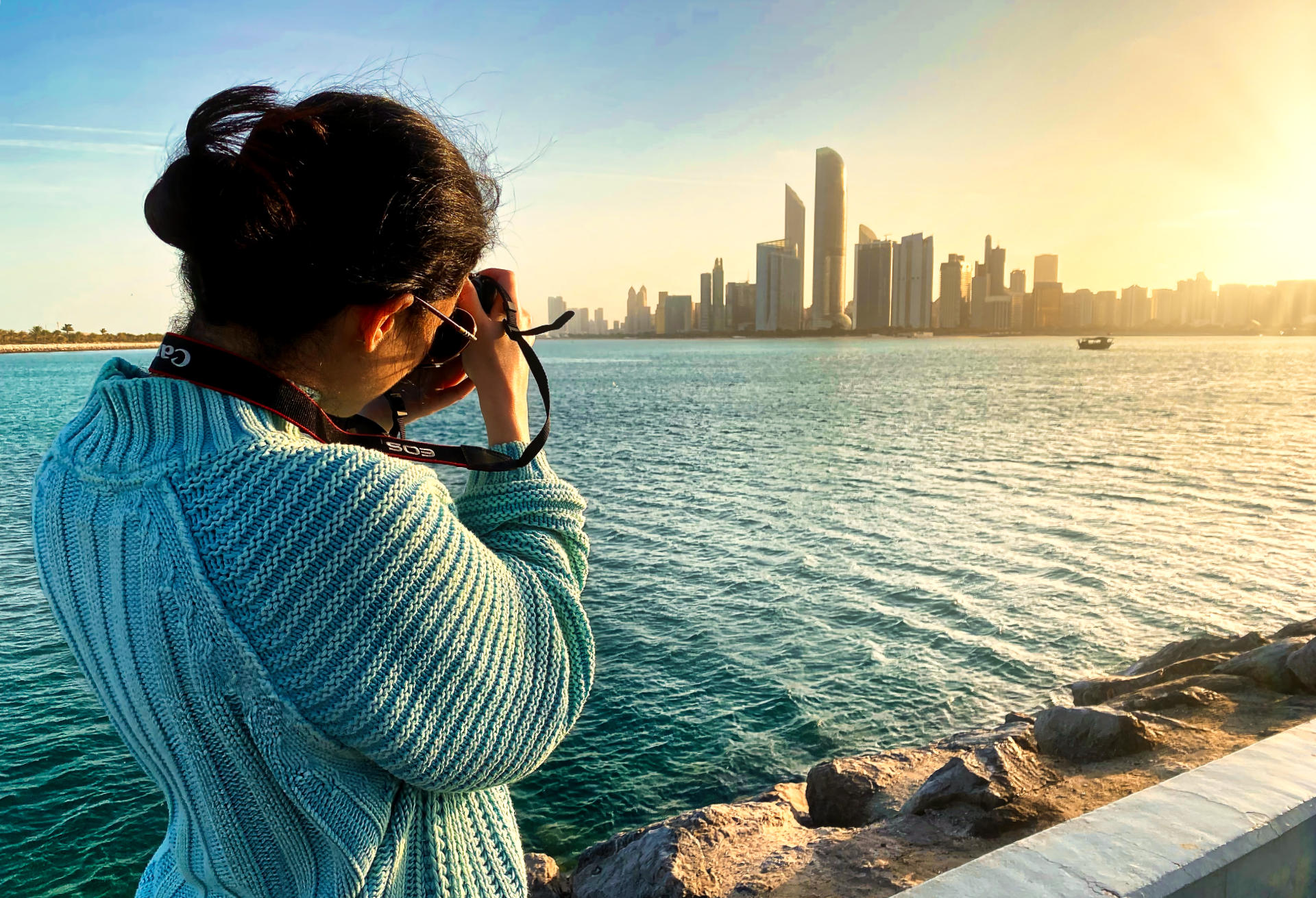 an abstract photo of a curved building with a blue sky in the background