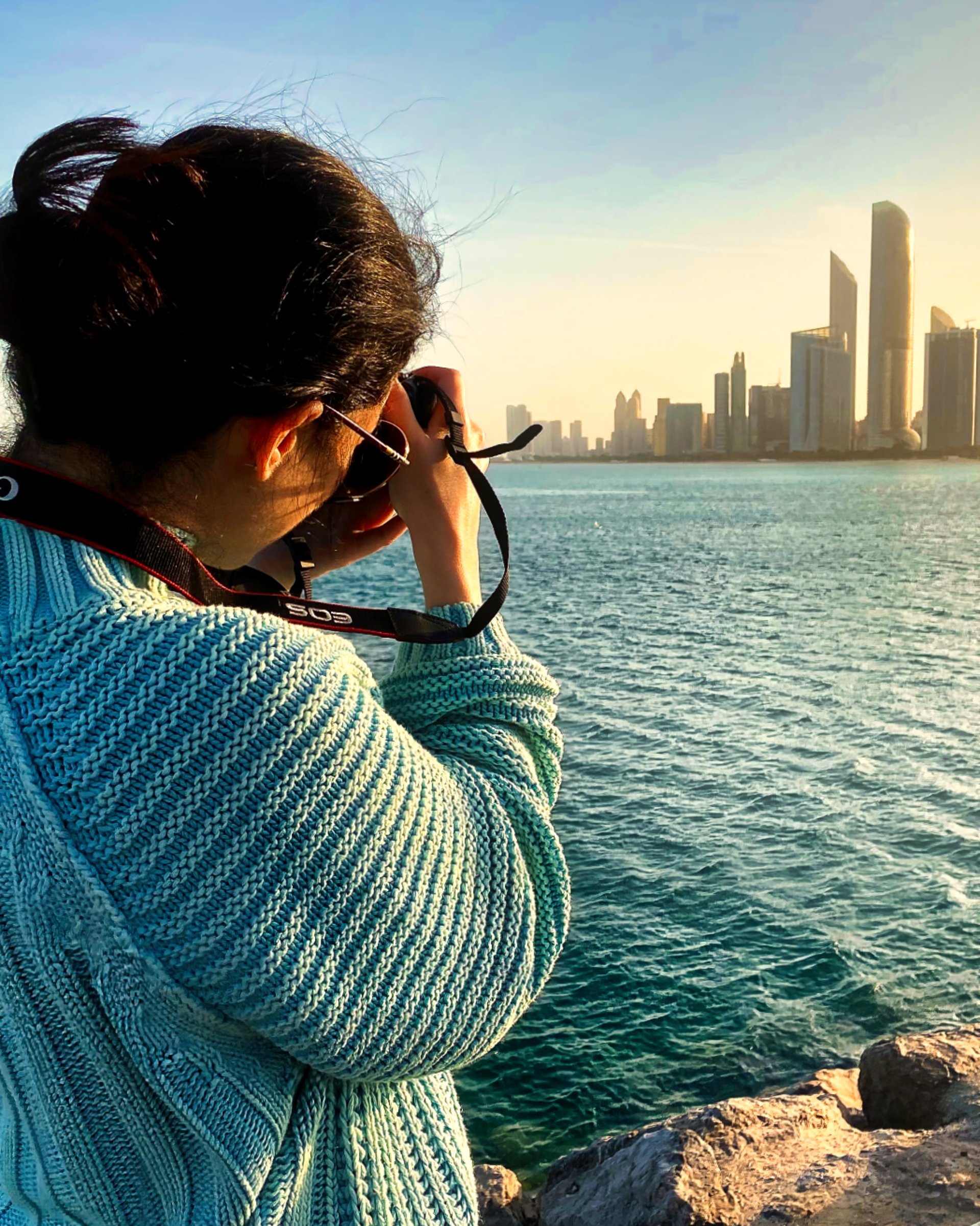 an abstract photo of a curved building with a blue sky in the background