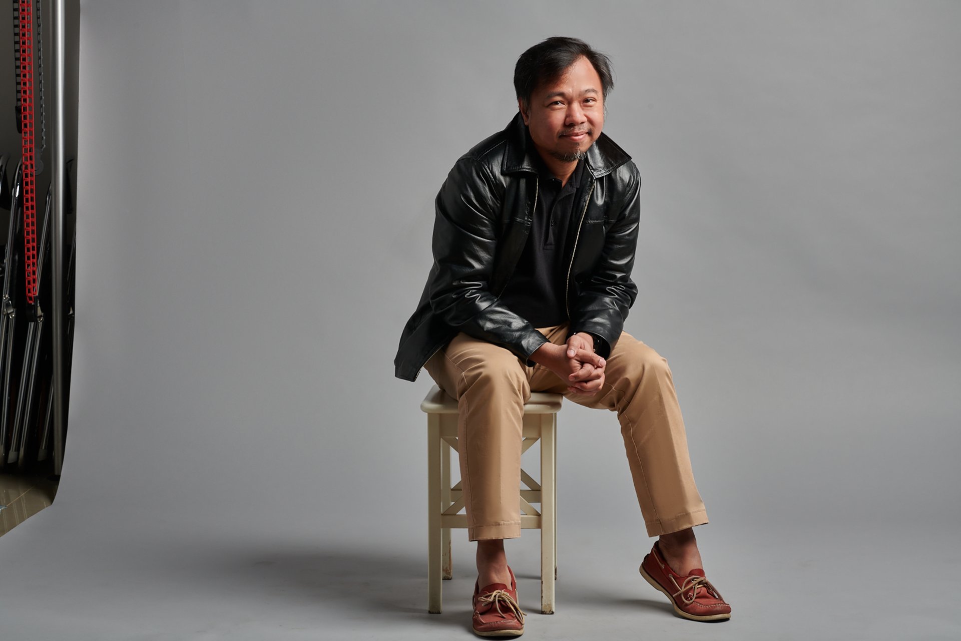 an abstract photo of a curved building with a blue sky in the background