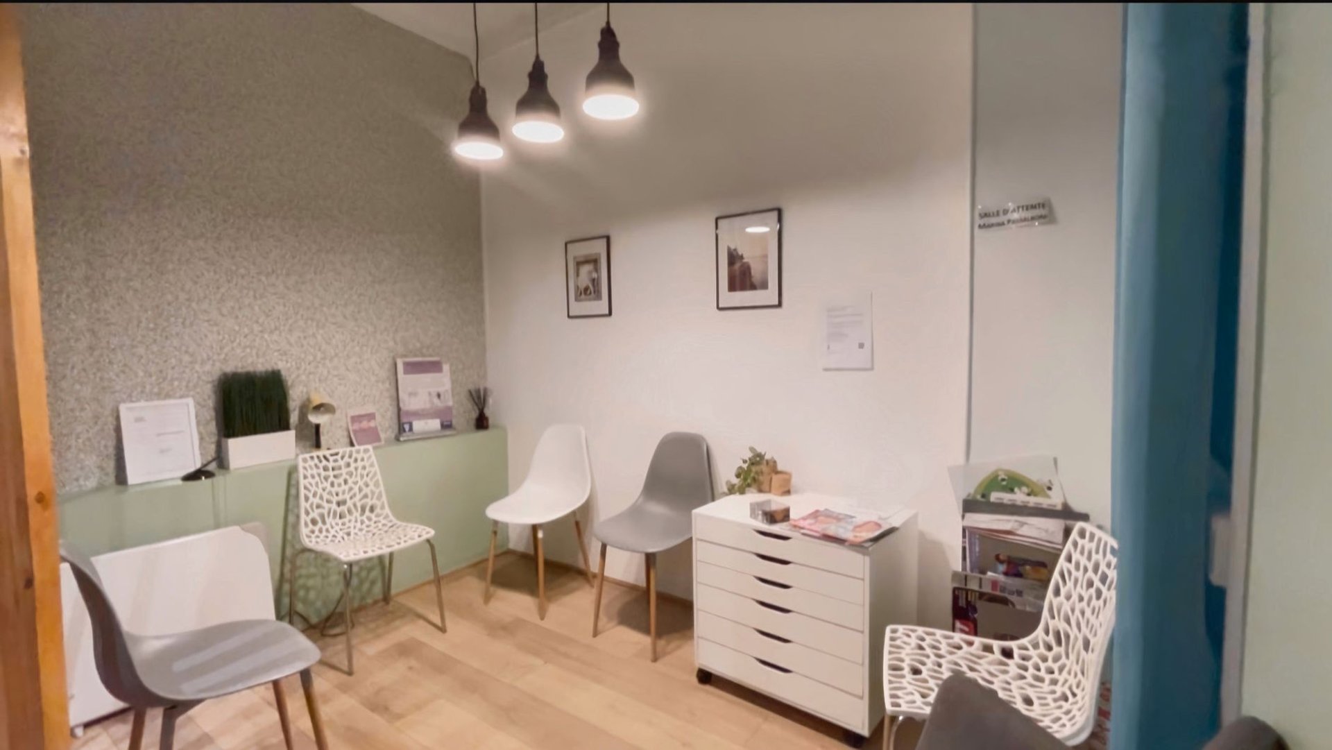 a room with a glass door that has a plant in it