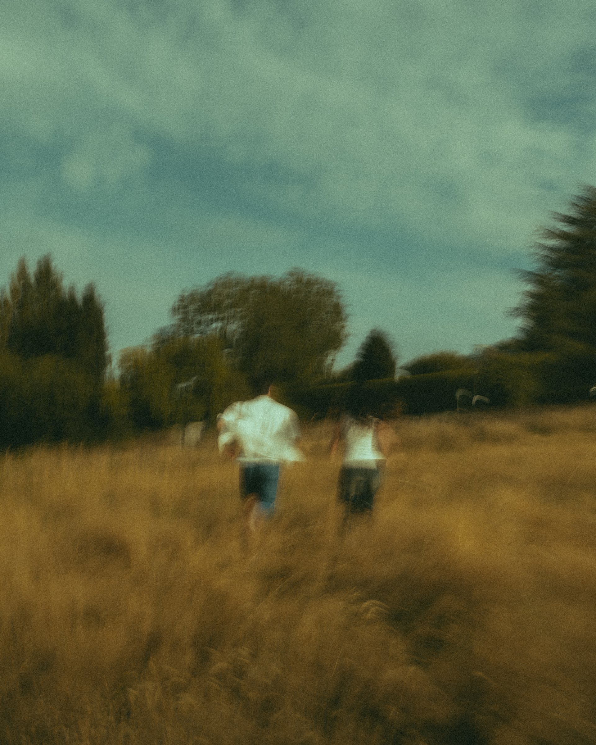 woman wearing yellow long-sleeved dress under white clouds and blue sky during daytime