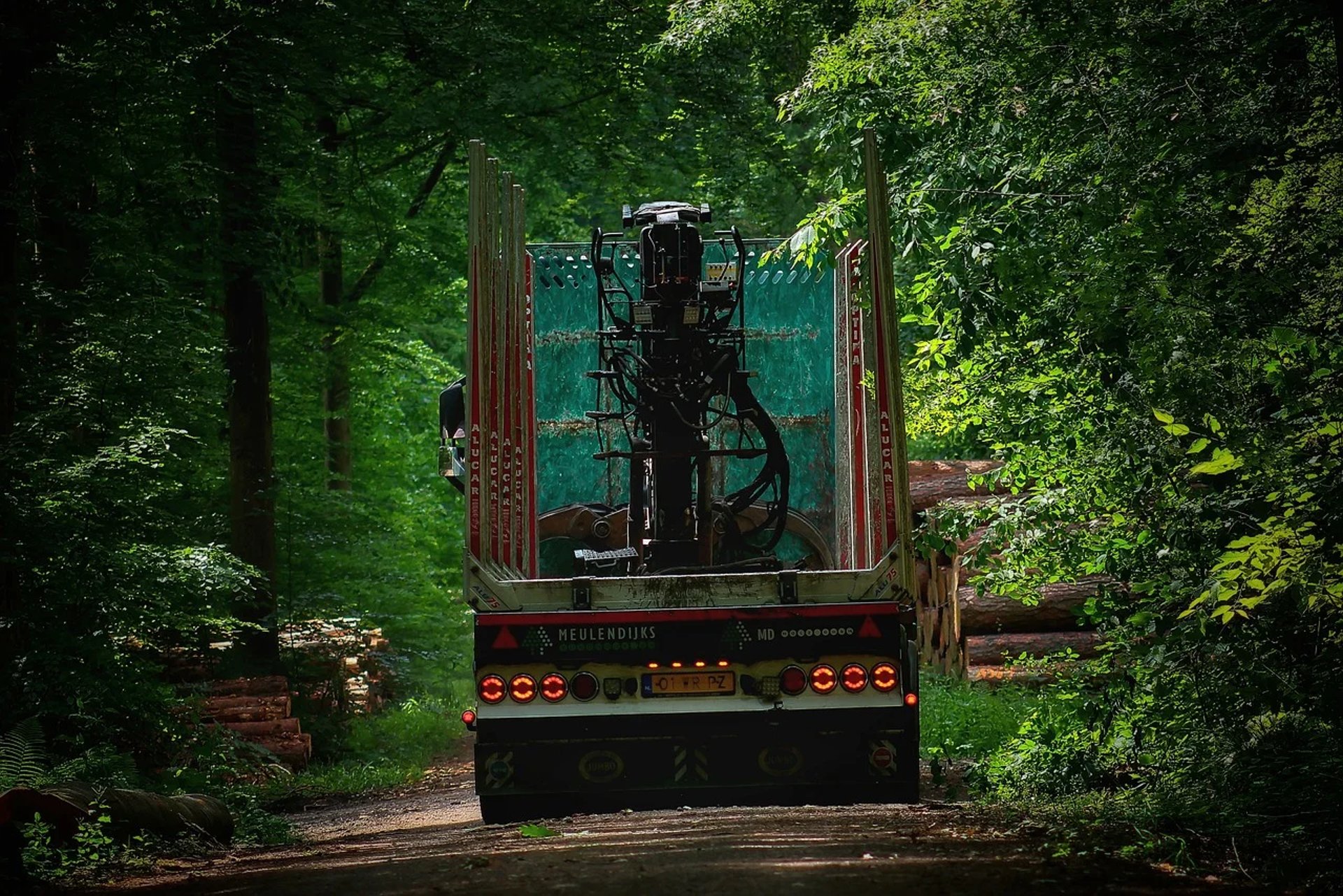 a white truck parked in front of a tall building