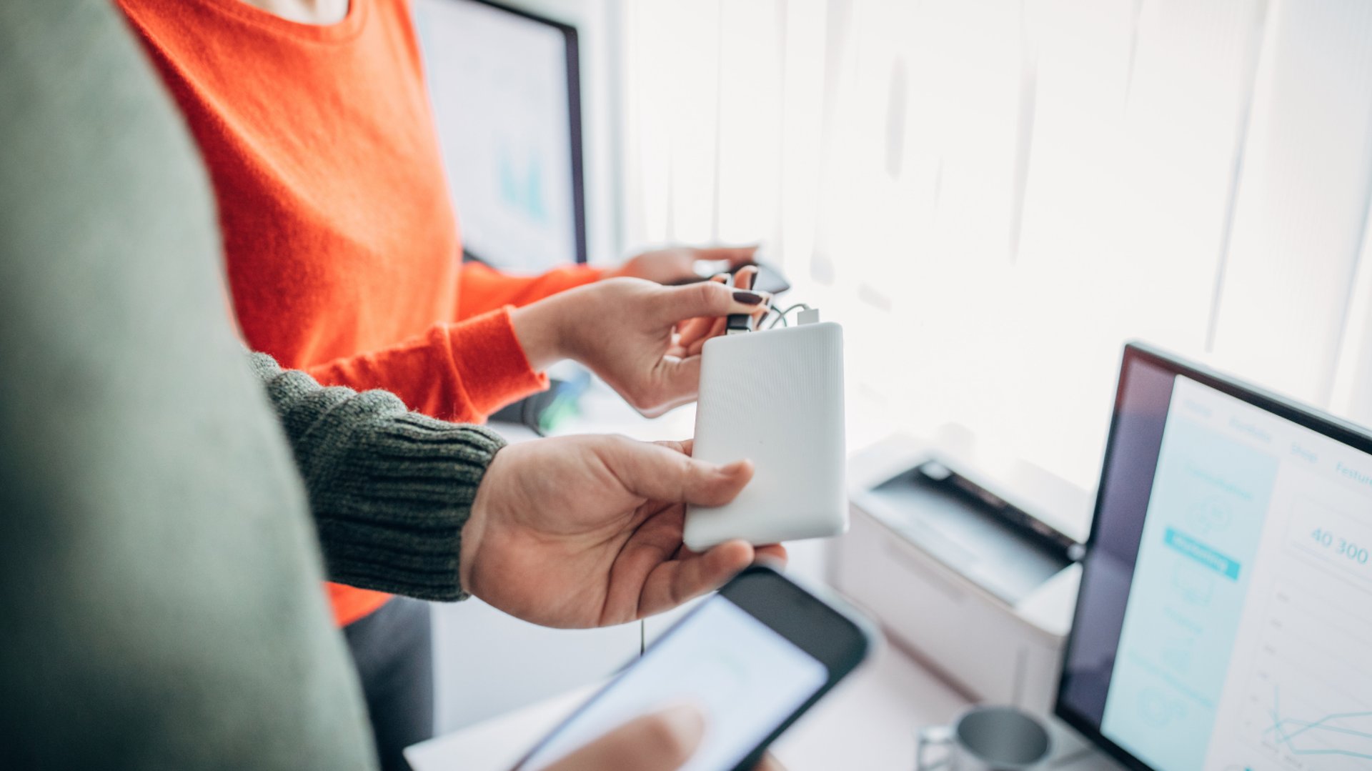 white and black box fan on brown wooden shelf