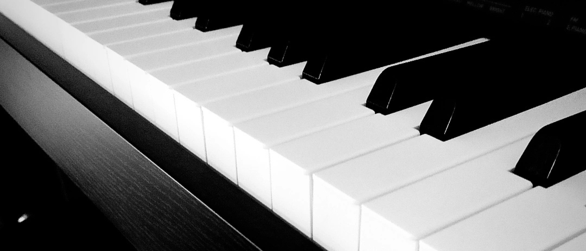 an abstract photo of a curved building with a blue sky in the background