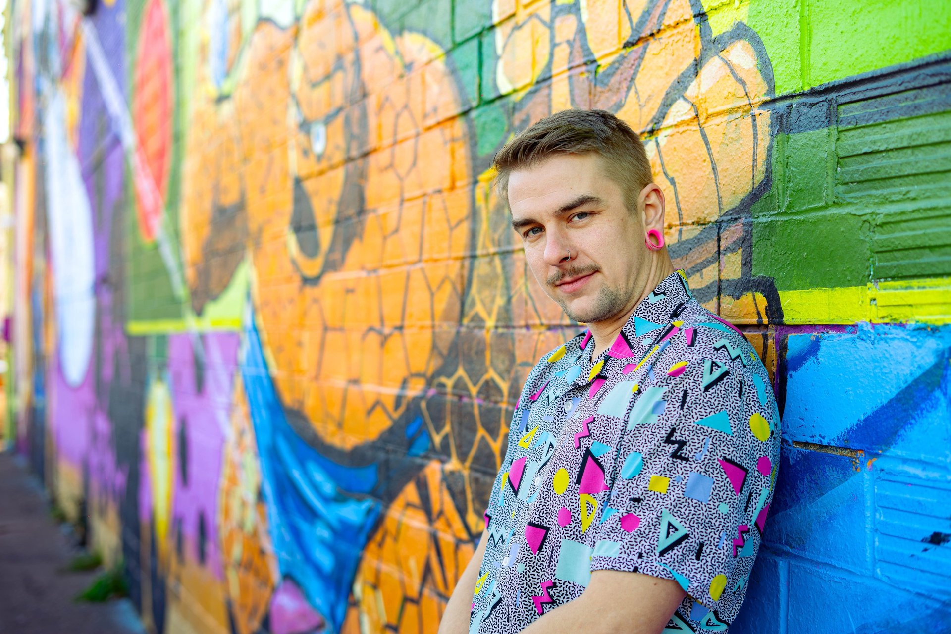 woman wearing yellow long-sleeved dress under white clouds and blue sky during daytime