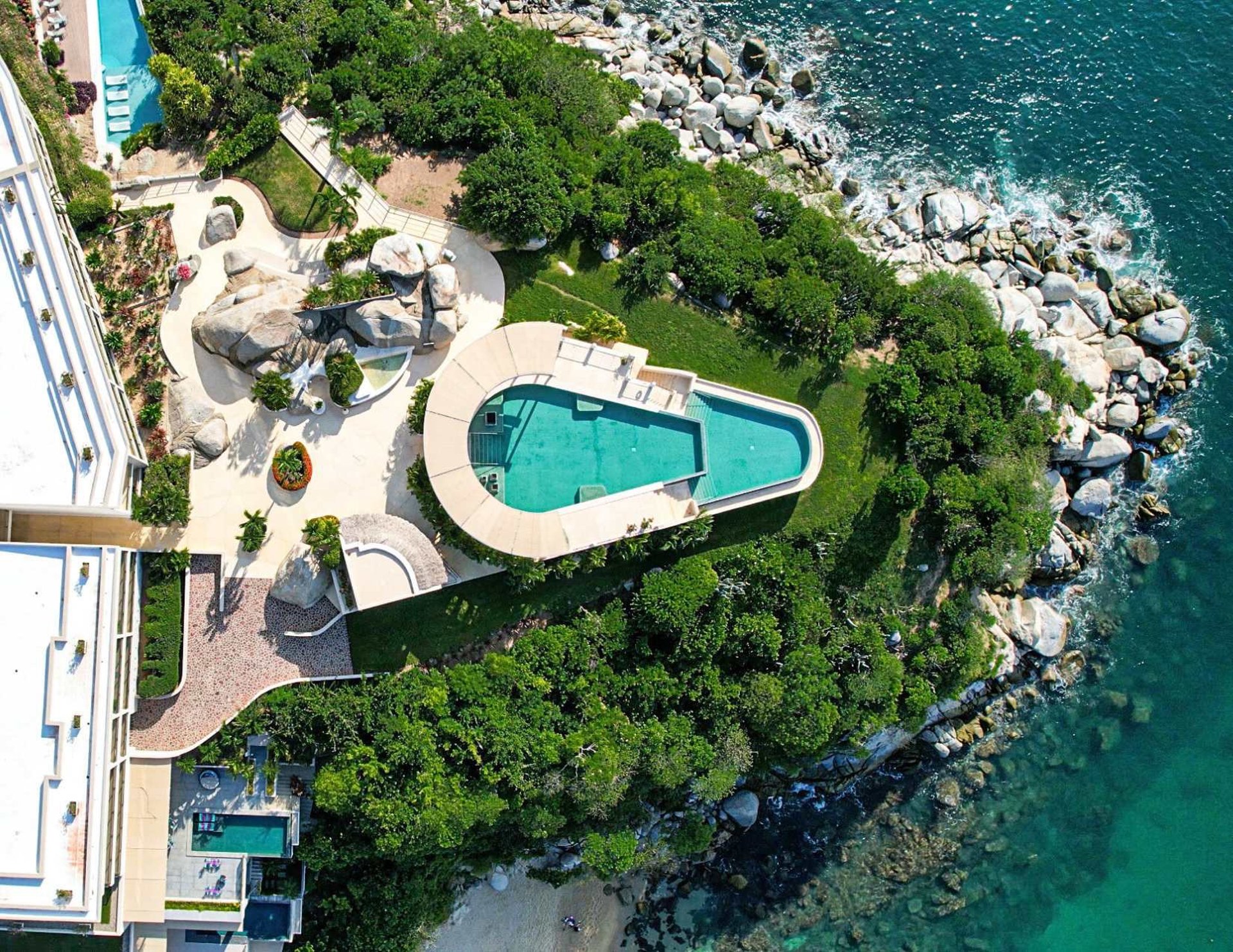 an abstract photo of a curved building with a blue sky in the background
