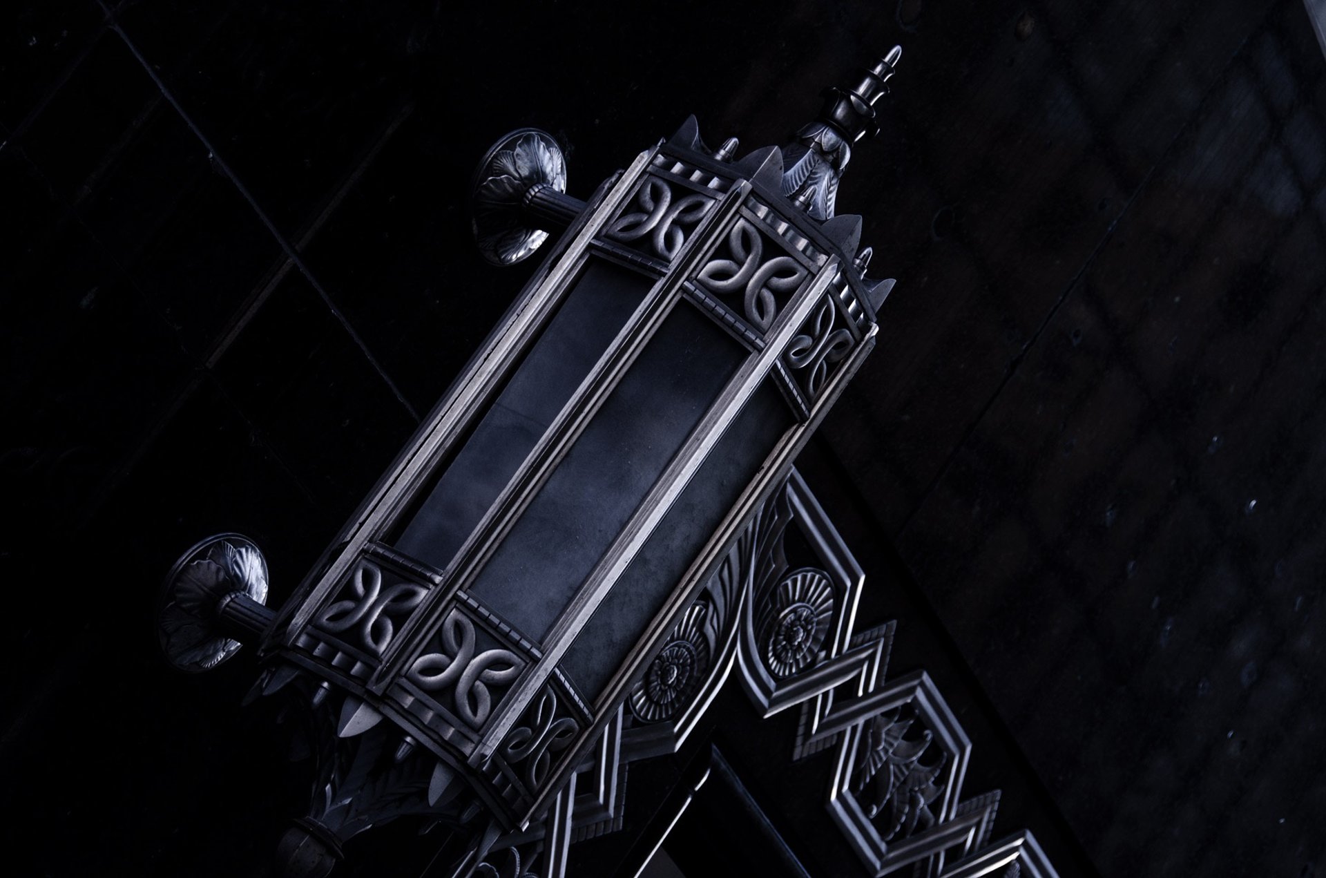 an abstract photo of a curved building with a blue sky in the background