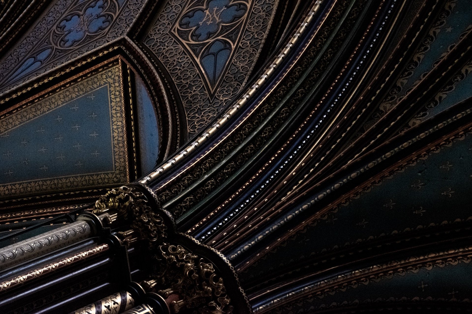 an abstract photo of a curved building with a blue sky in the background