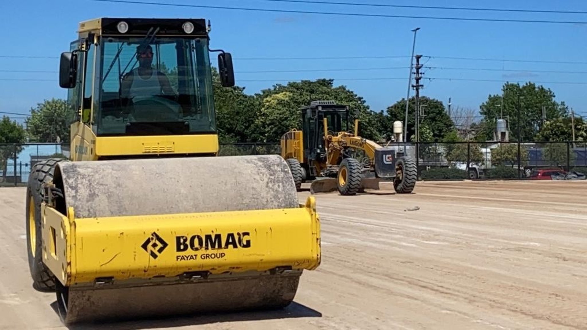 an abstract photo of a curved building with a blue sky in the background