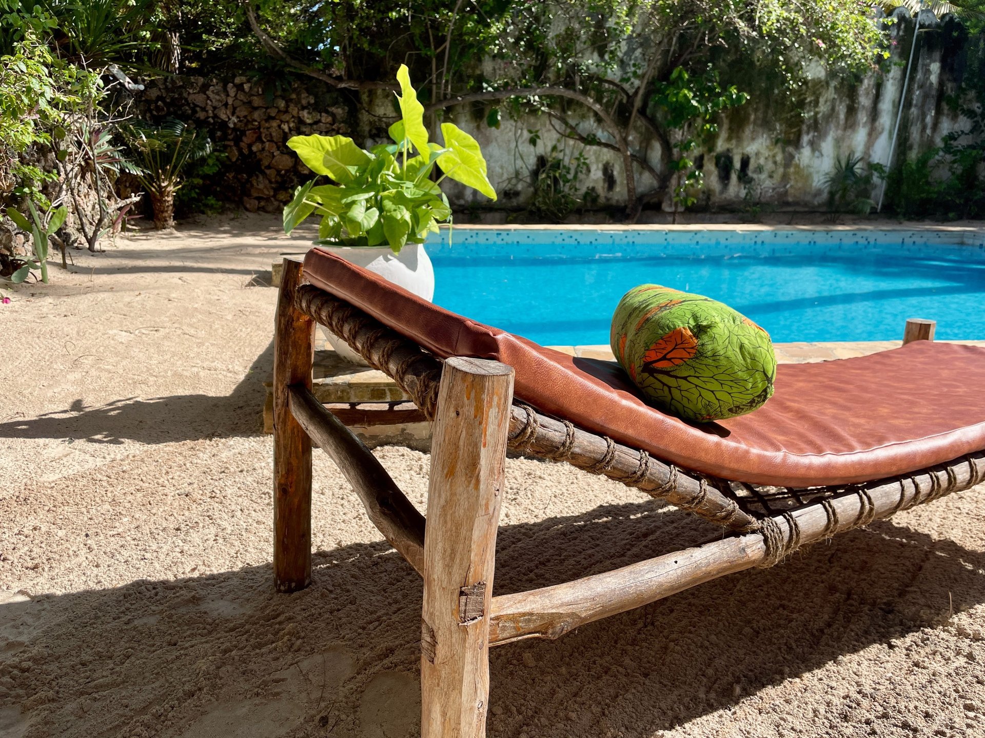 an abstract photo of a curved building with a blue sky in the background
